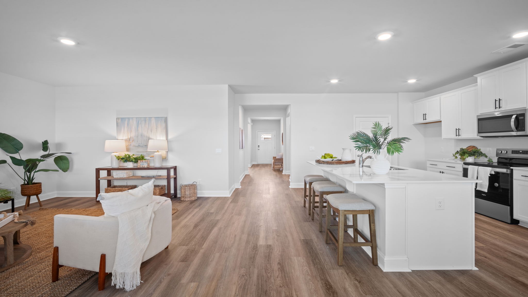 Living area with kitchen and dining area in the back.