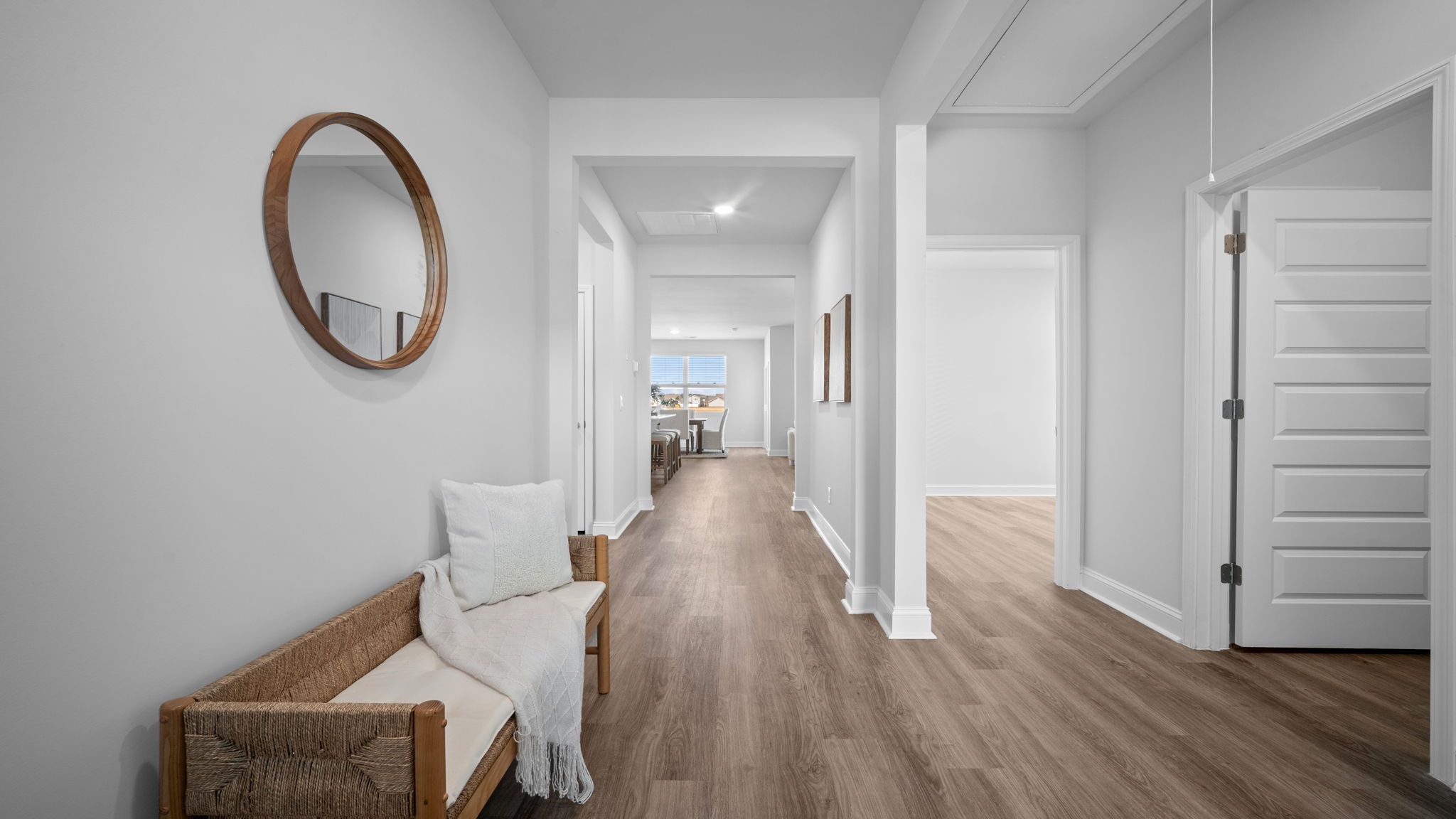 Welcoming foyer entrance in the Aria floor plan showcasing luxury vinyl plank flooring, natural light, and an open-concept layout designed for modern living.