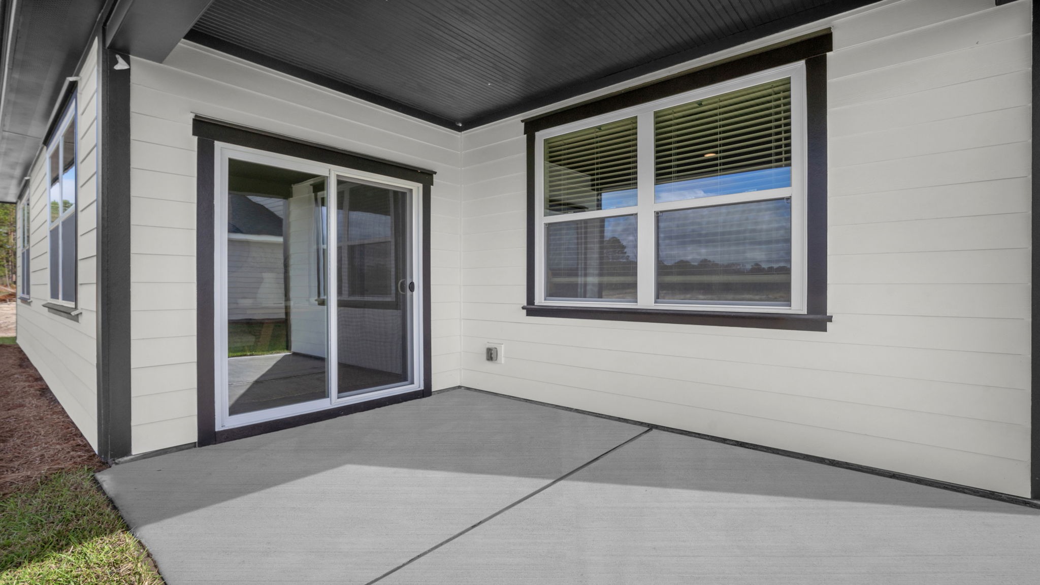 Covered back patio in Aria floor plan ideal for outdoor living and Lowcountry relaxation in The Retreat at East Argent