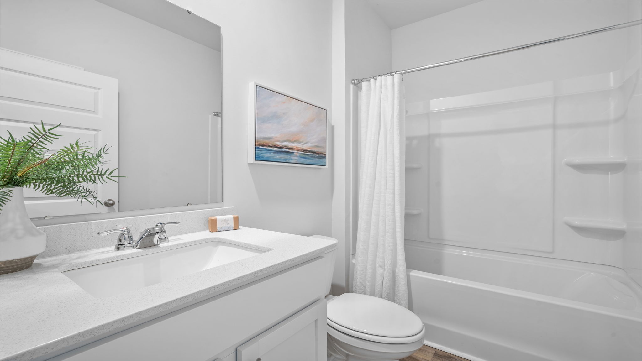Beautiful guest bathroom in the Aria floor plan featuring contemporary fixtures, functional design, and convenient accessibility.