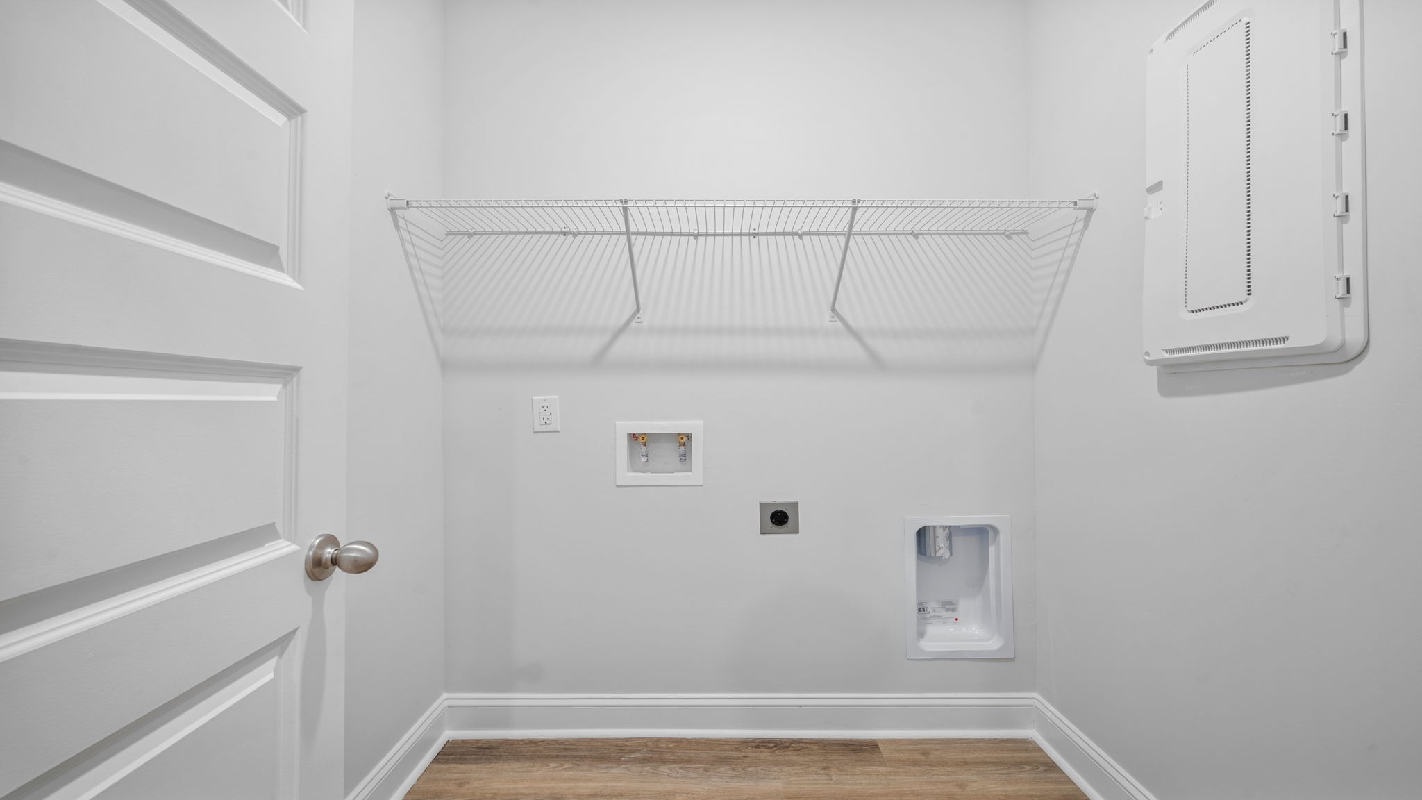 Dedicated laundry room in the Aria floor plan offering practical workspace, storage potential, and everyday convenience.