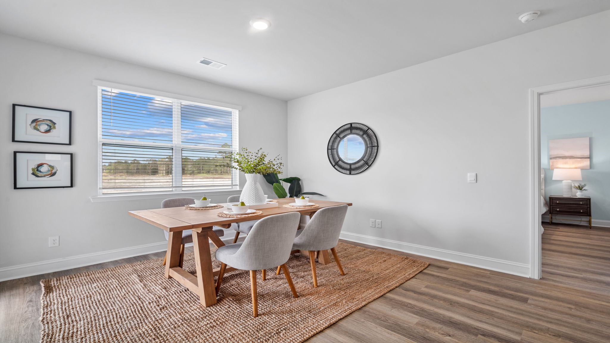 Bright dining area in the Aria floor plan featuring abundant natural light and an open layout connecting the kitchen and great room.