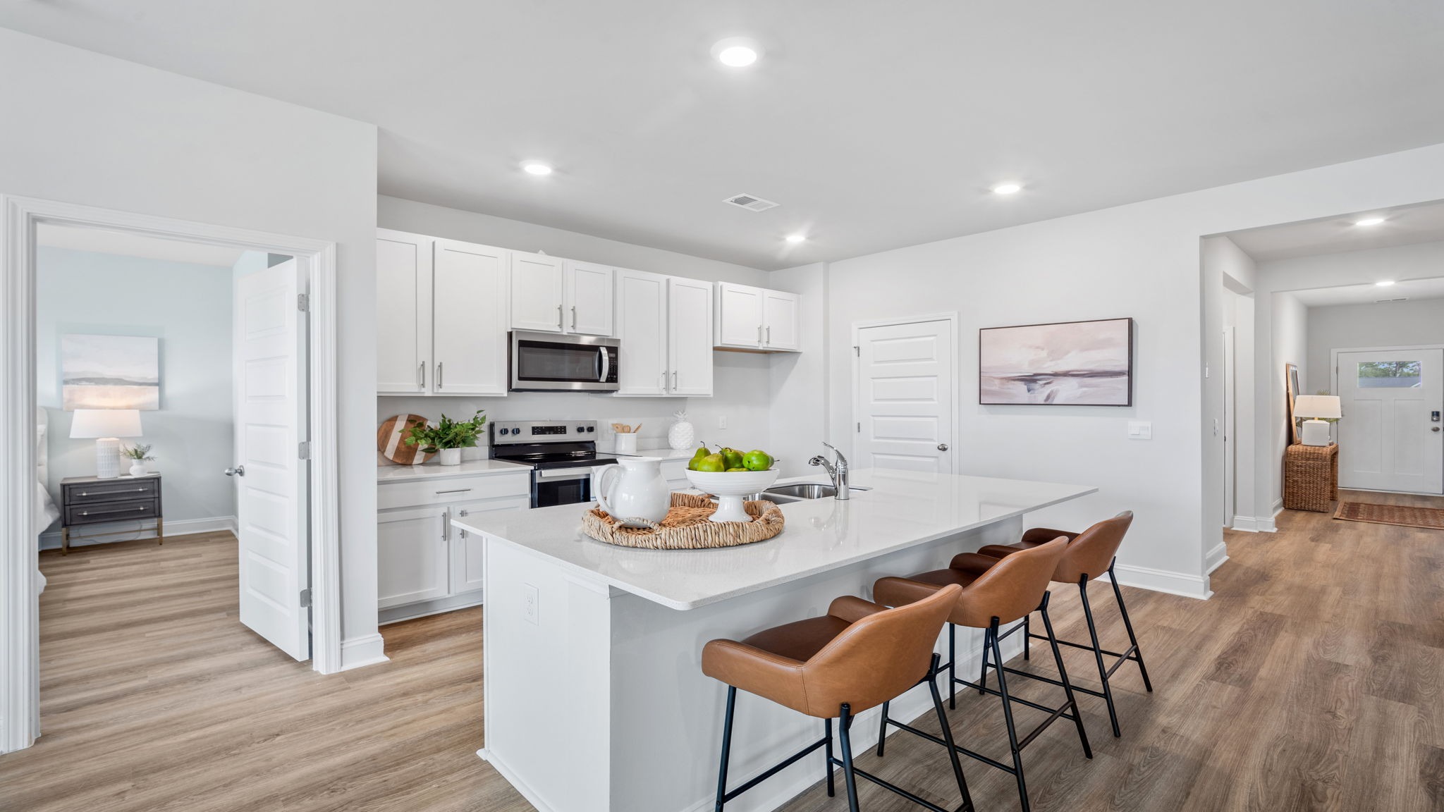 Gourmet kitchen in the Aria floor plan showcasing granite countertops, stainless steel appliances, abundant cabinetry, and a spacious center island.