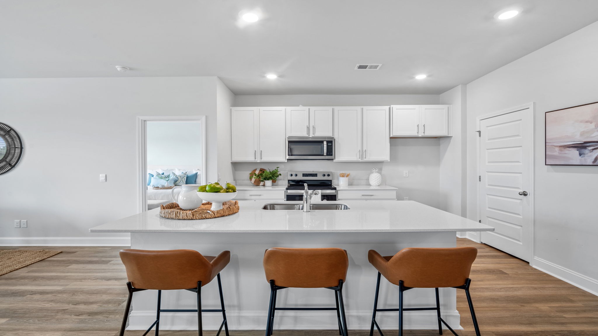 Gourmet kitchen in the Aria floor plan featuring granite countertops, stainless steel appliances, ample cabinetry, and a large island perfect for entertaining.