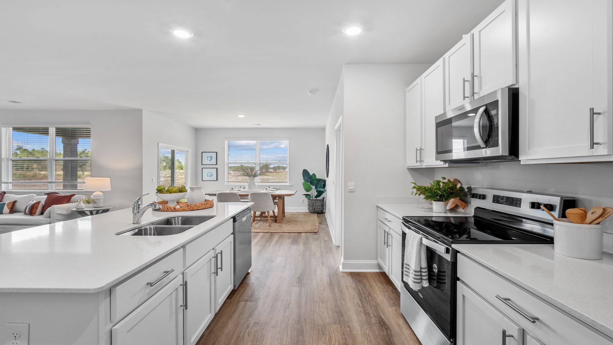 Chef-inspired kitchen featuring modern cabinetry, granite surfaces, and an oversized island at the heart of the Aria floor plan.