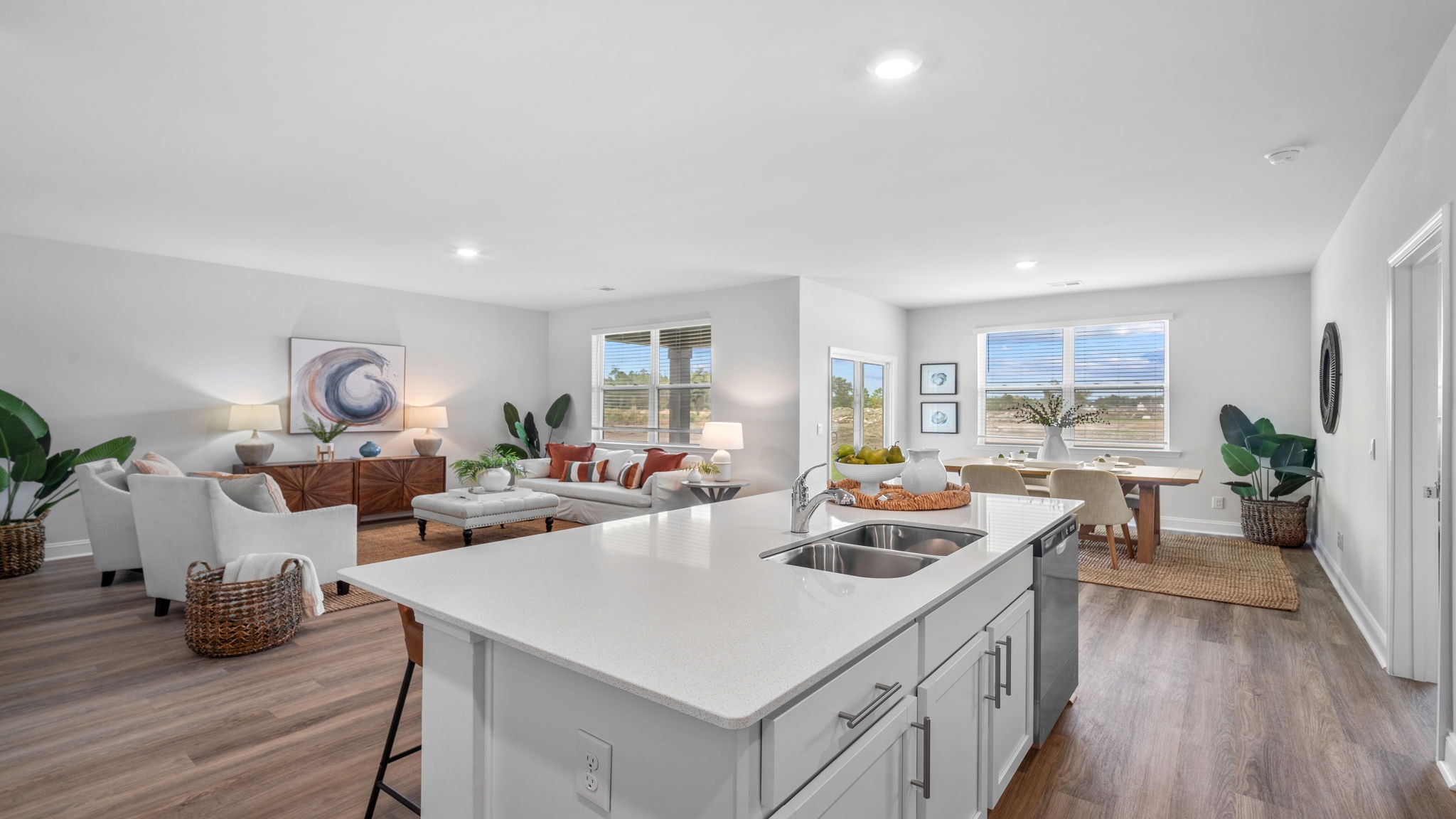 Oversized kitchen island in the Aria floor plan offering additional seating, spacious prep areas, and a central gathering space for family and guests.