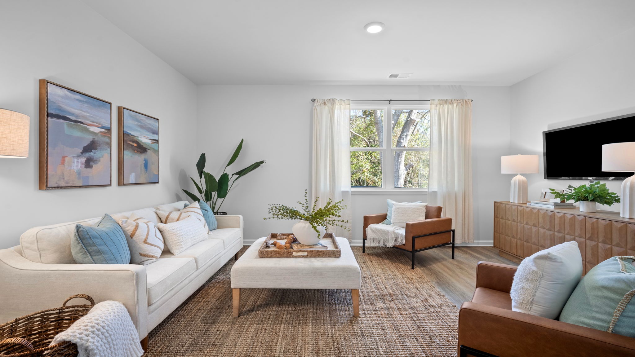 Spacious family room in the Cali home showcasing modern finishes and seamless flow throughout the main living areas.