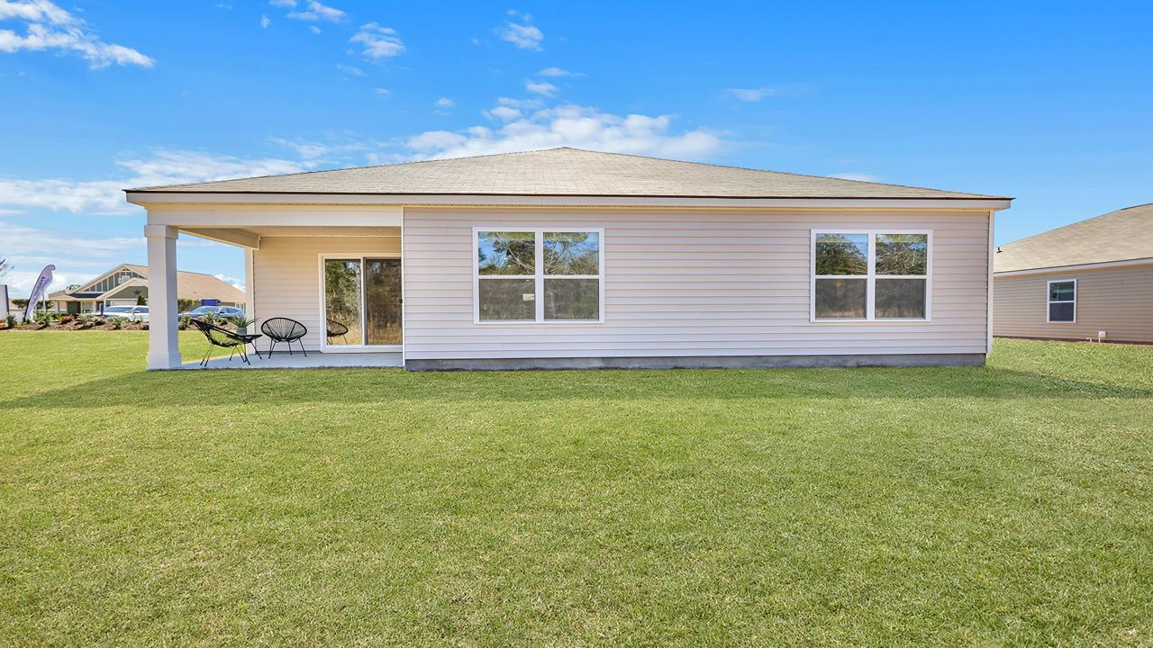 rear view of home with covered patio
