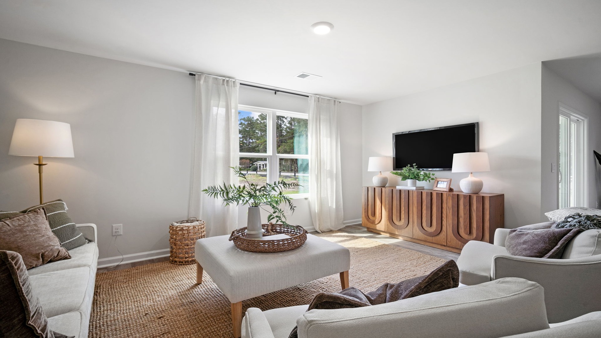 Living room decorated with a couch and chairs