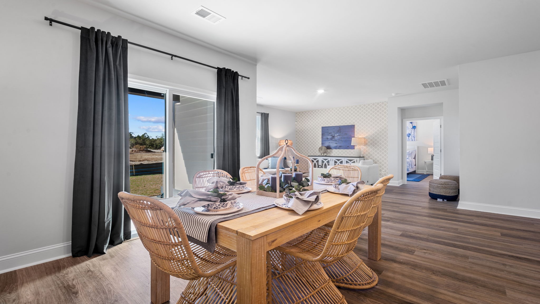 Elegant dining area in the Cali floor plan offering abundant natural light and seamless flow between the kitchen and great room.