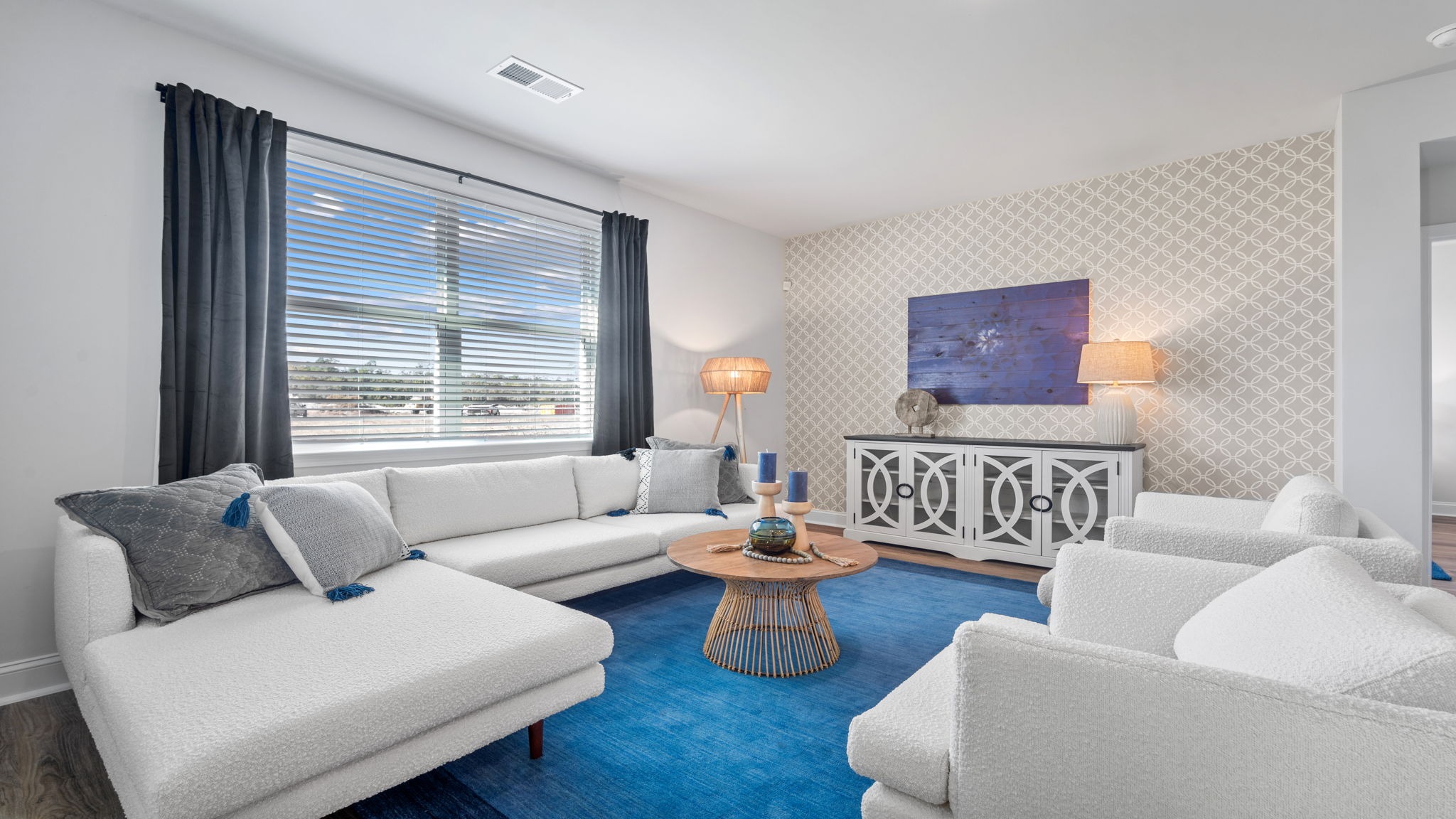 Inviting living area designed for entertaining and everyday living with seamless access to the kitchen and dining room.