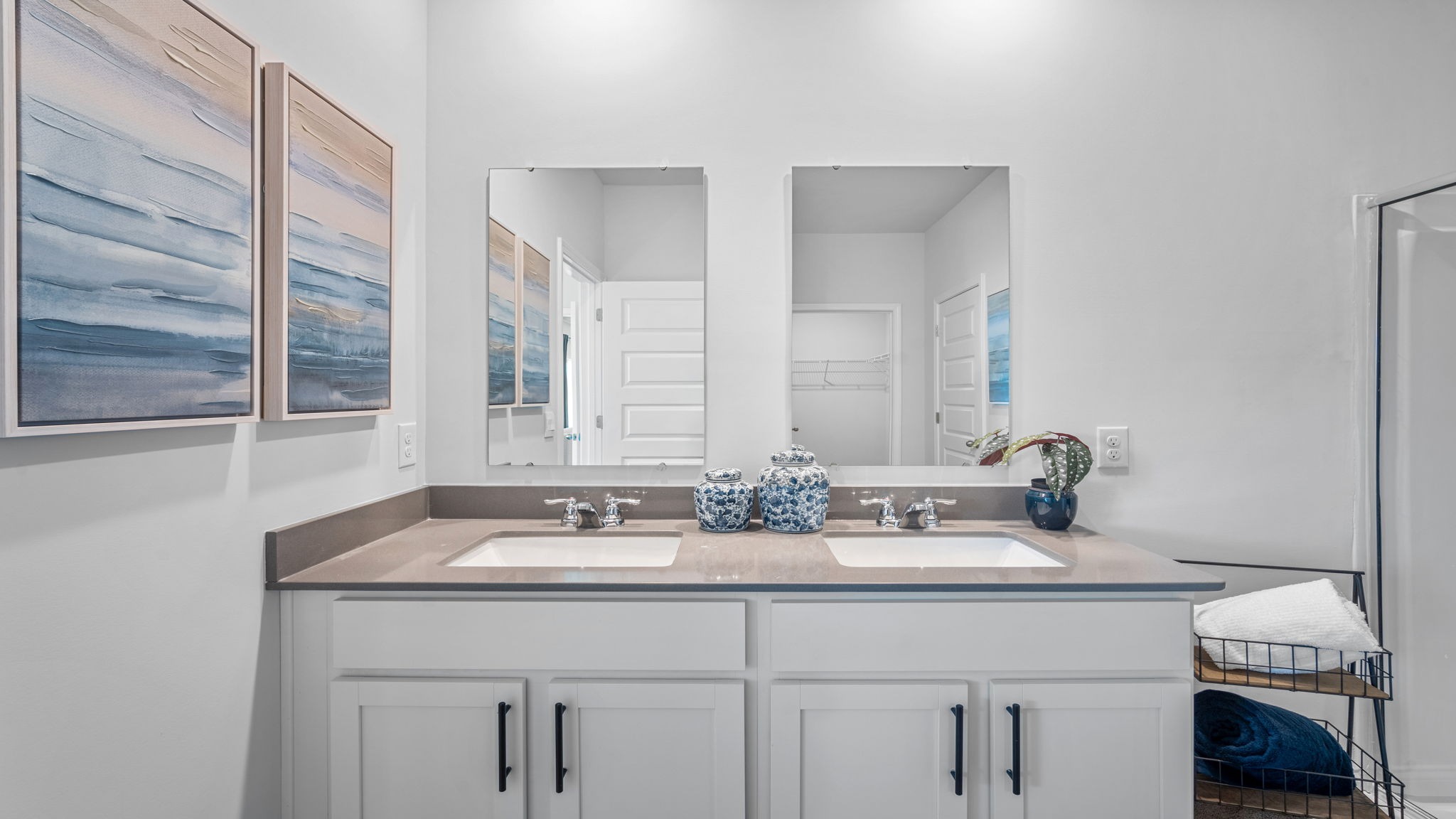 Beautiful owner's bath with stylish fixtures, ample storage, and a spacious walk-in shower.
