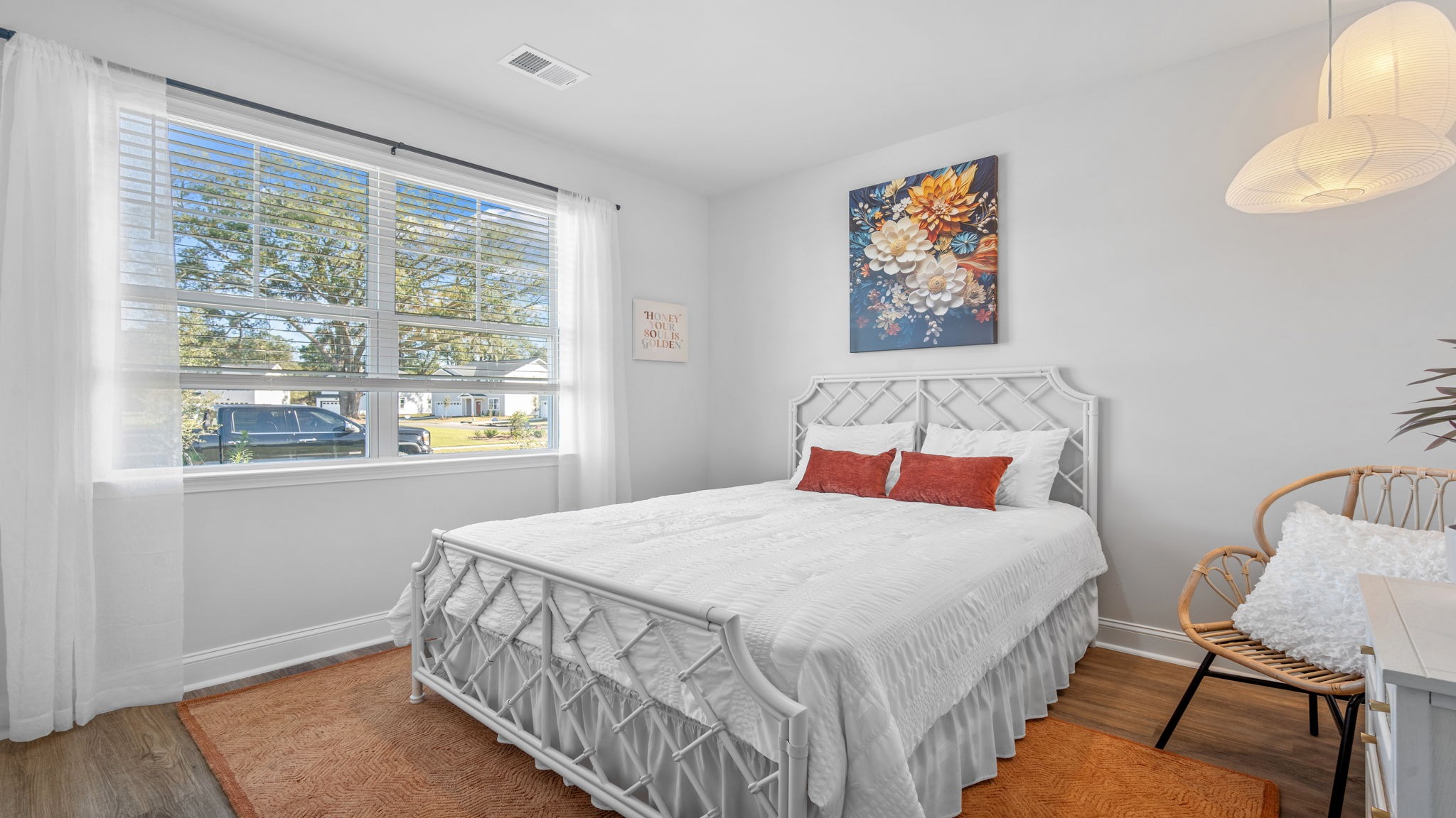 Comfortable guest bedroom in the Cali floor plan featuring generous closet space, natural light, and versatile functionality.