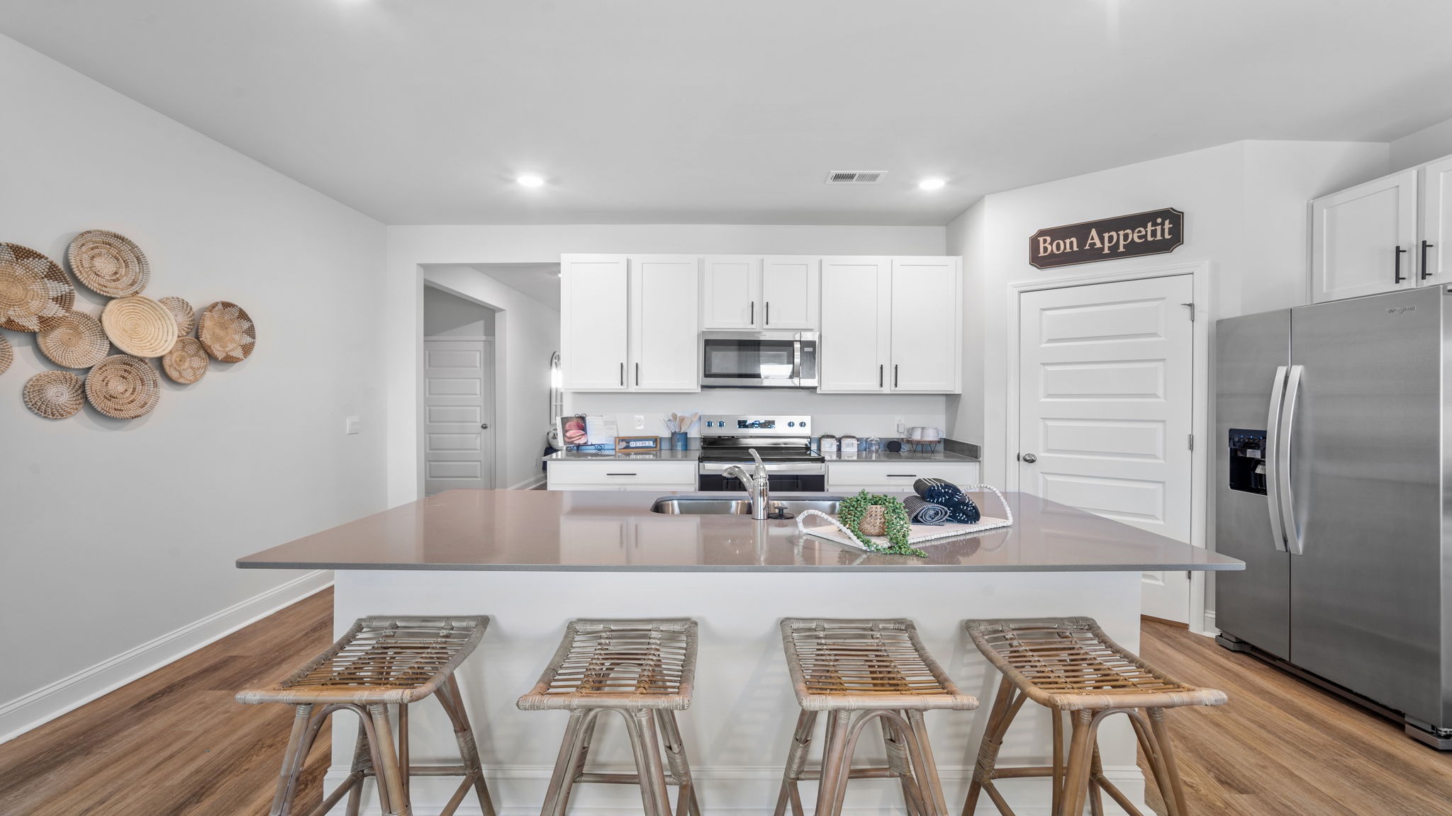 Stunning center island in the Cali floor plan kitchen offering ample prep space, casual dining seating, and an ideal hub for entertaining guests.