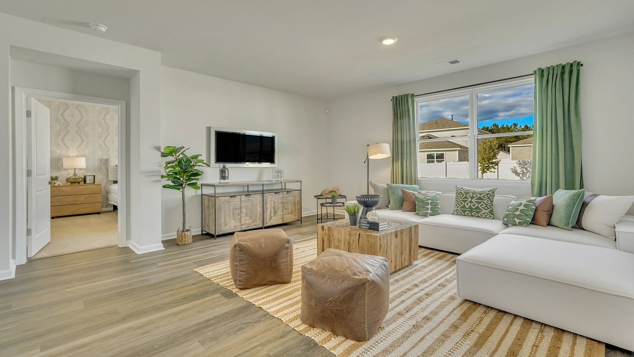 Living room decorated with a couch and chairs
