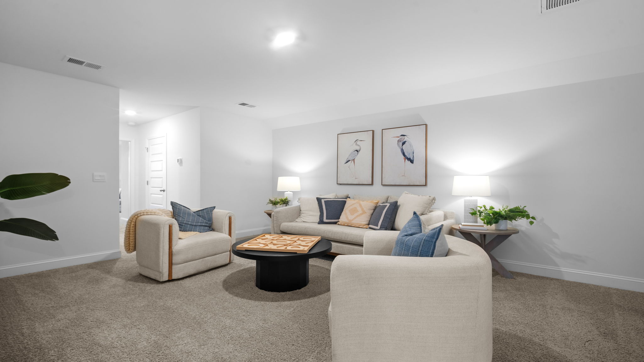 Upstairs living area decorated with seating