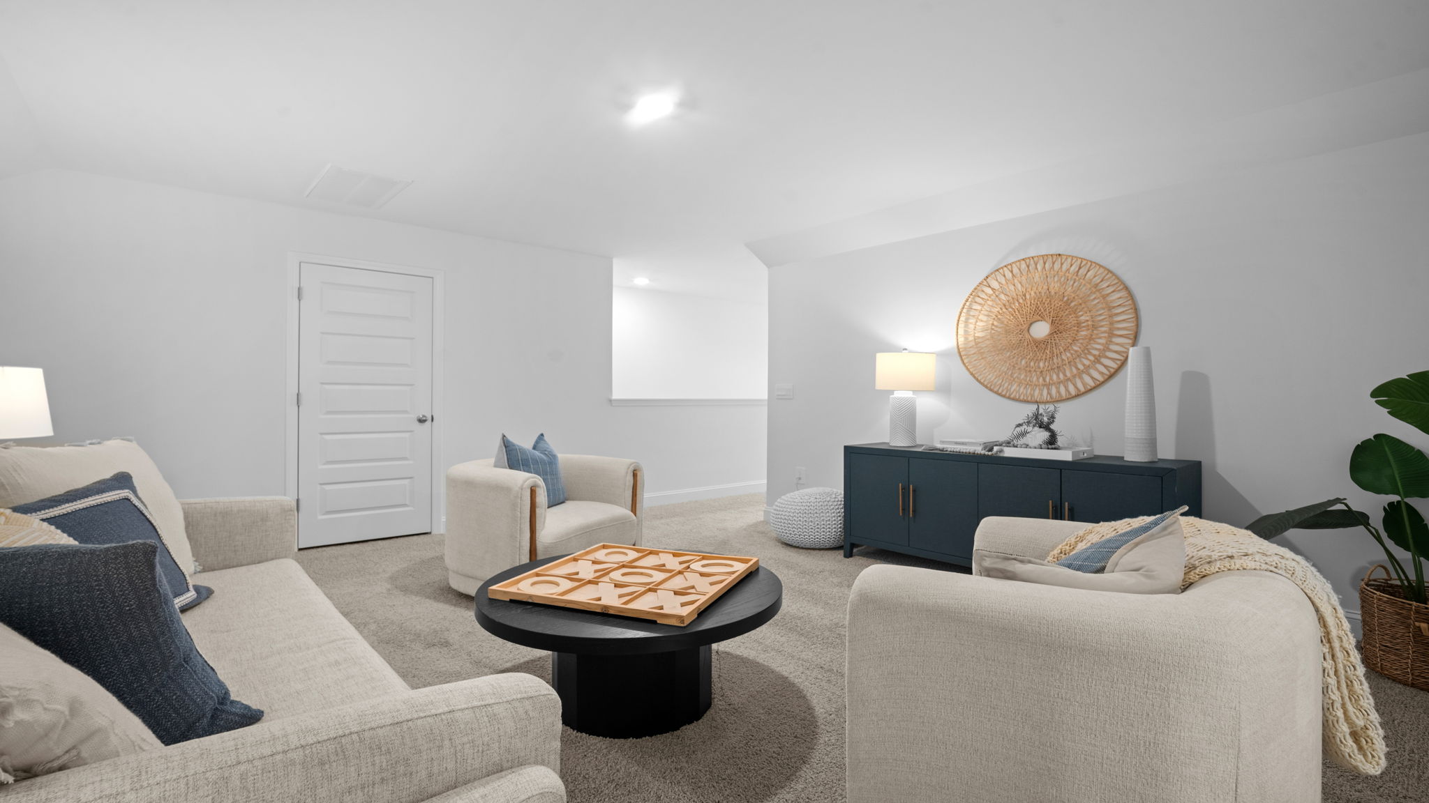 Upstairs living area decorated with seating