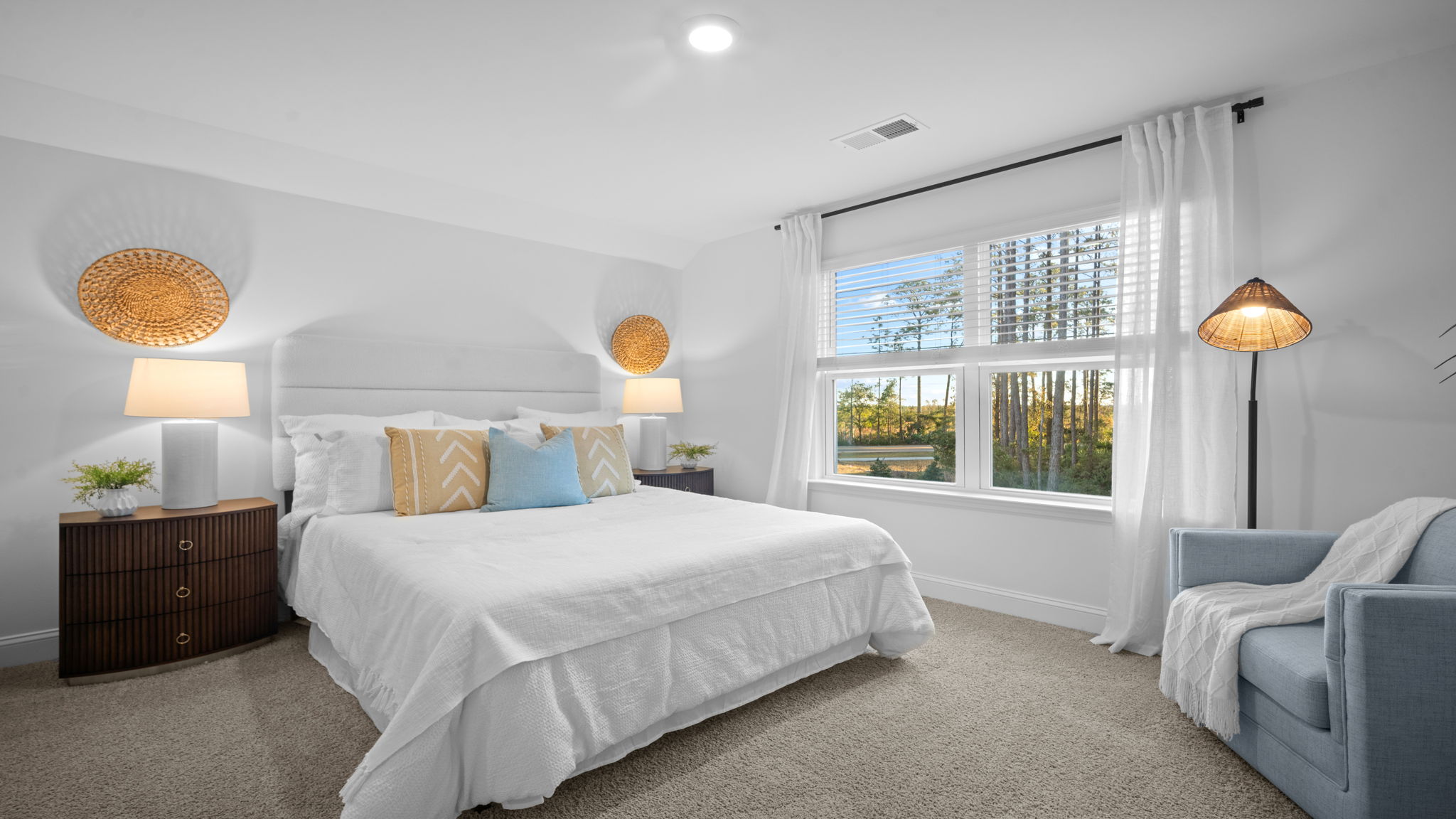 Upstairs guest bedroom decorated with a bed