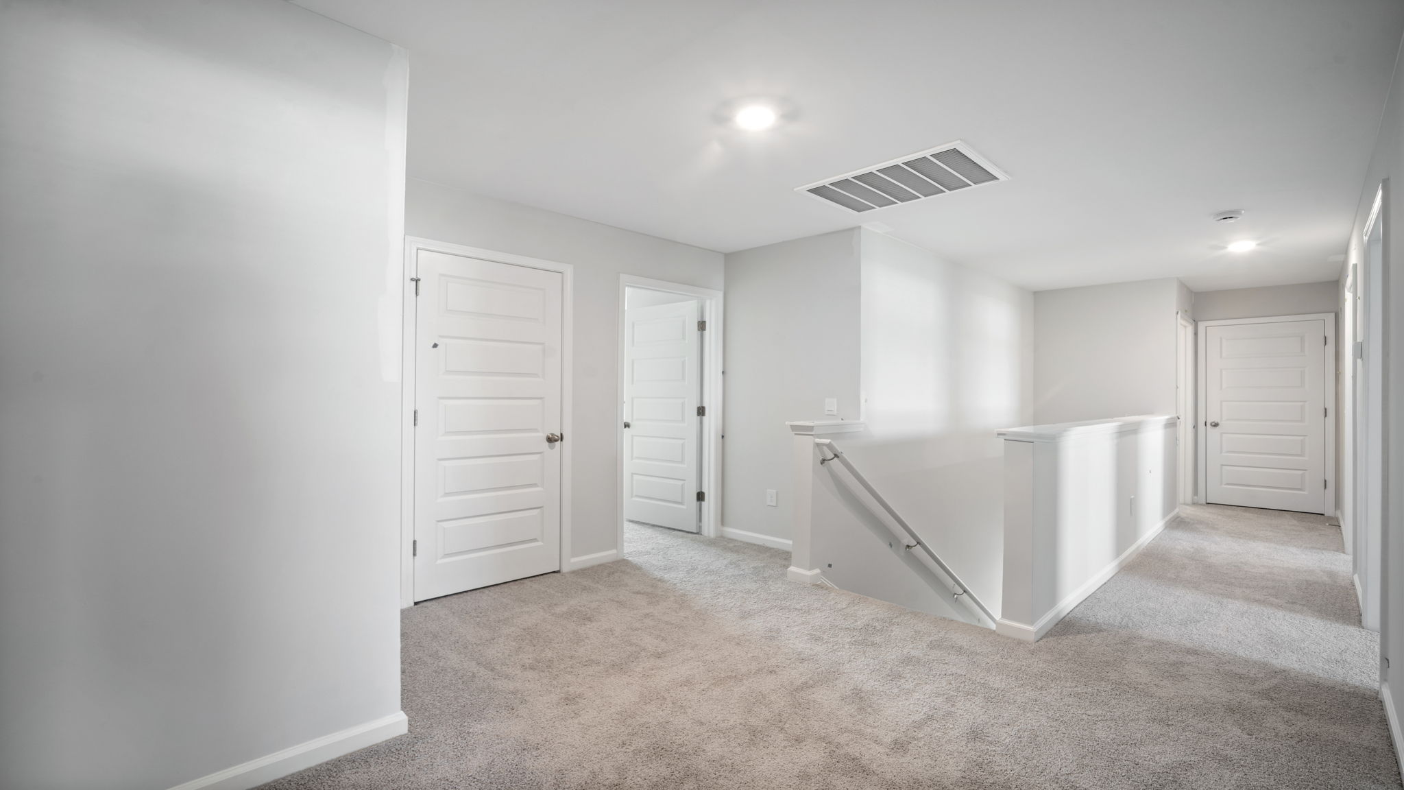 Upstairs hallway leading to different bedrooms