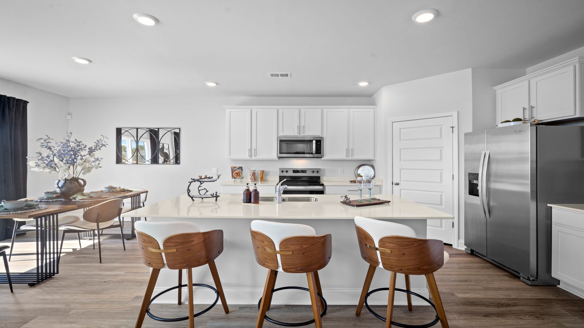 Open dining area in the Hayden floor plan featuring natural light, convenient kitchen access, and ample space for family meals and entertaining.