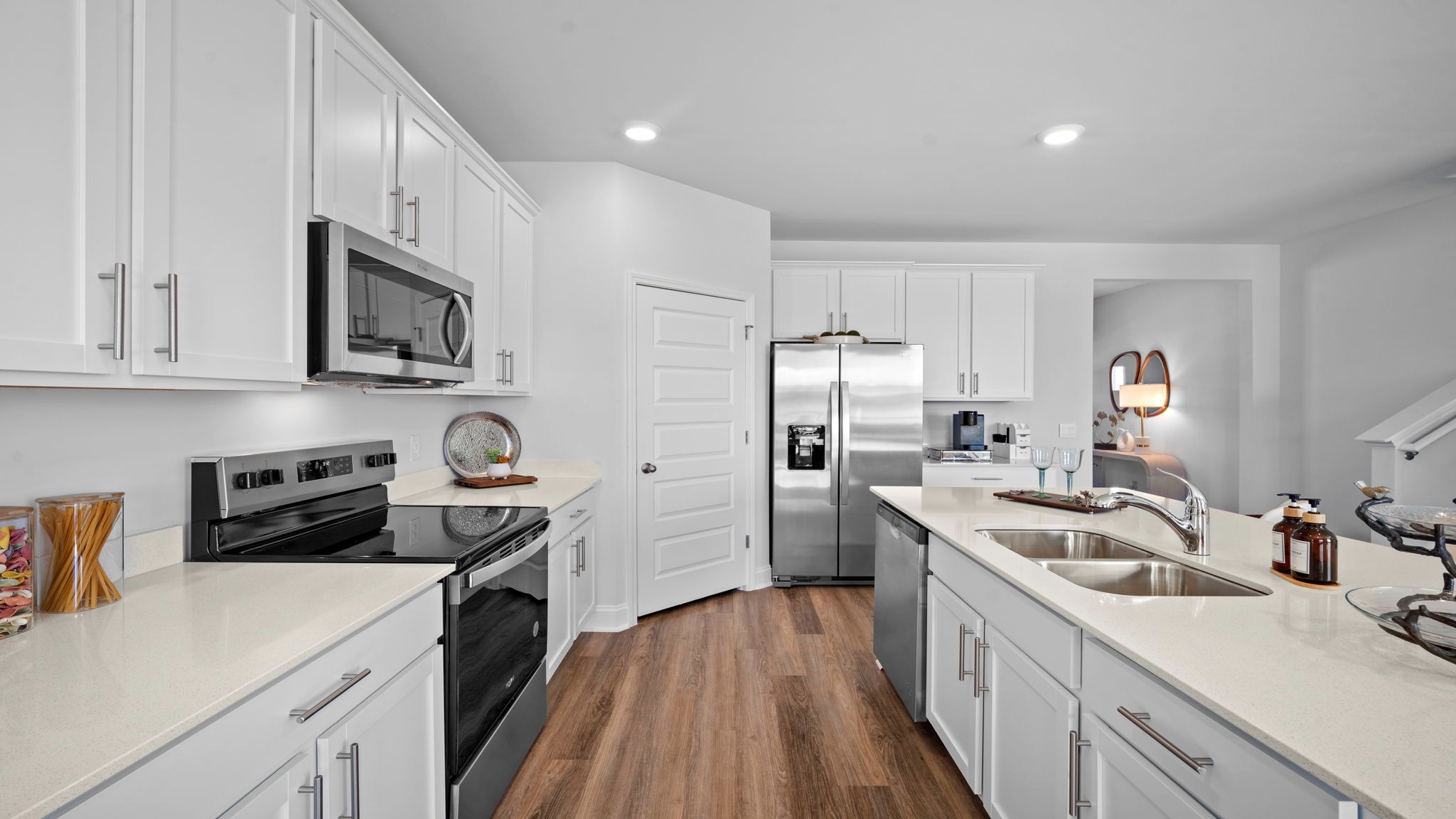 Open-concept kitchen designed for entertaining with abundant counter space, stylish finishes, and seamless flow into the dining and living areas.