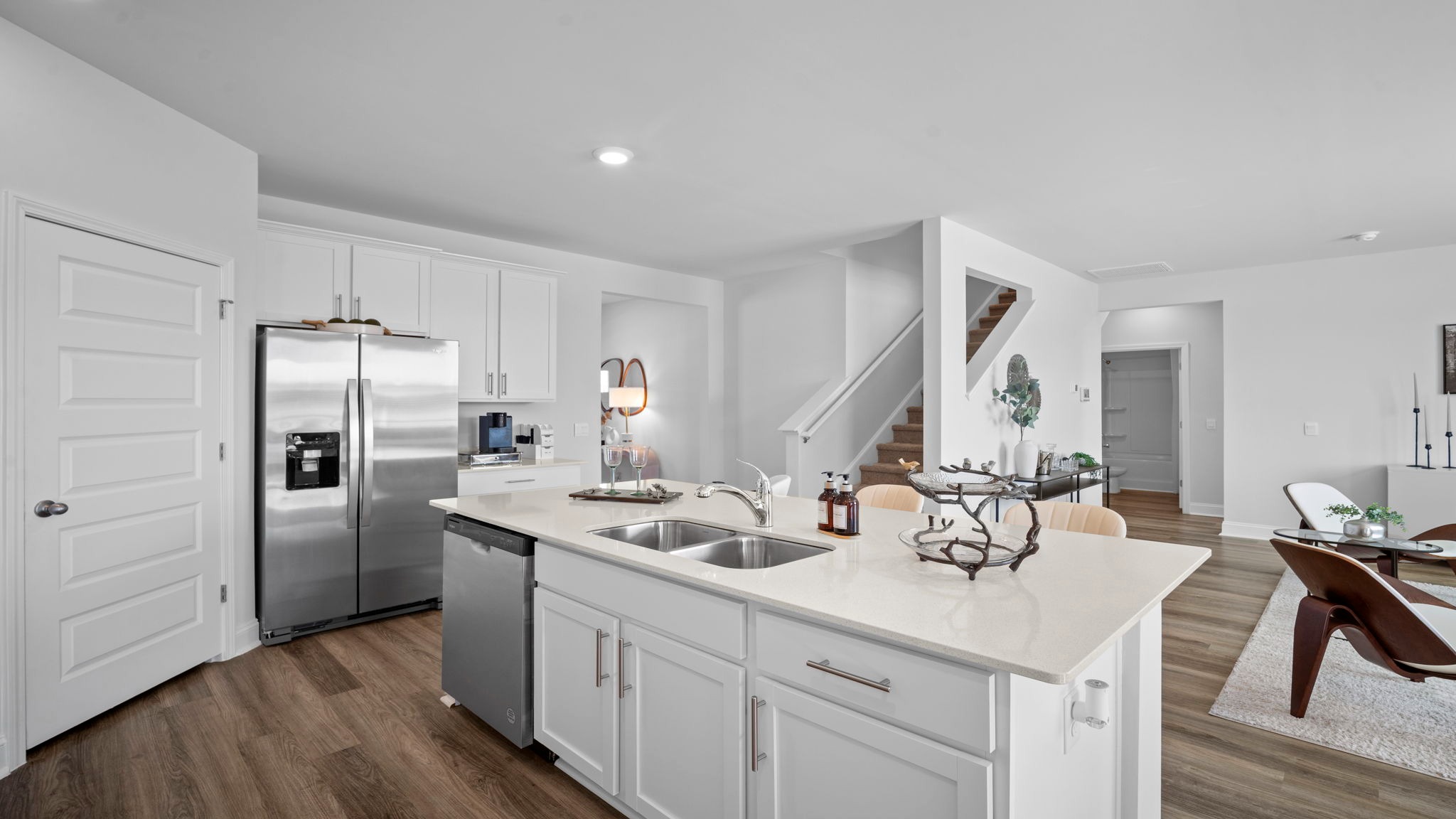 Chef-inspired kitchen in the Hayden home offering island seating, ample storage, and contemporary design elements.