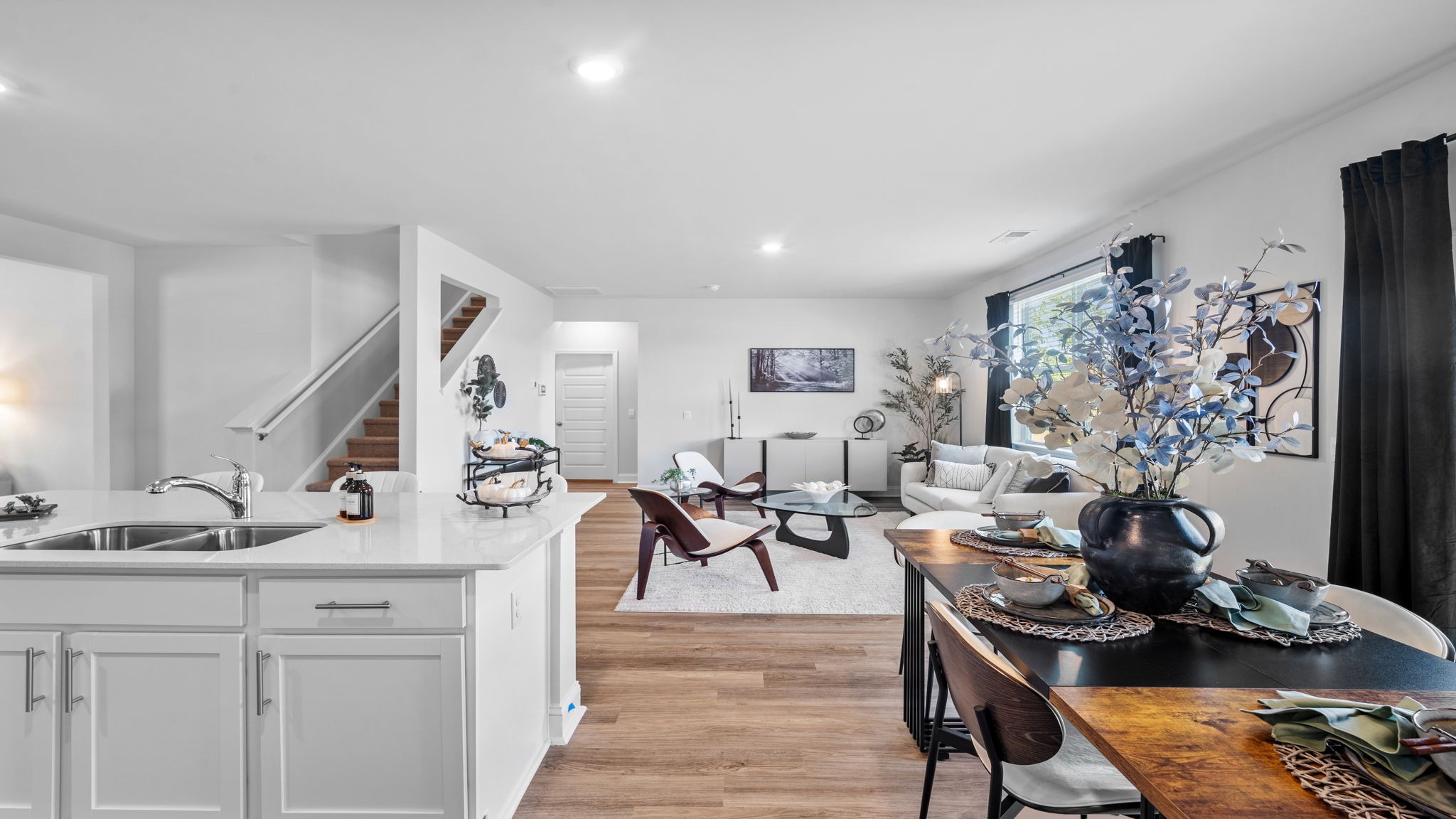 Bright living area seamlessly connected to the kitchen and dining room, creating the perfect space for everyday living.