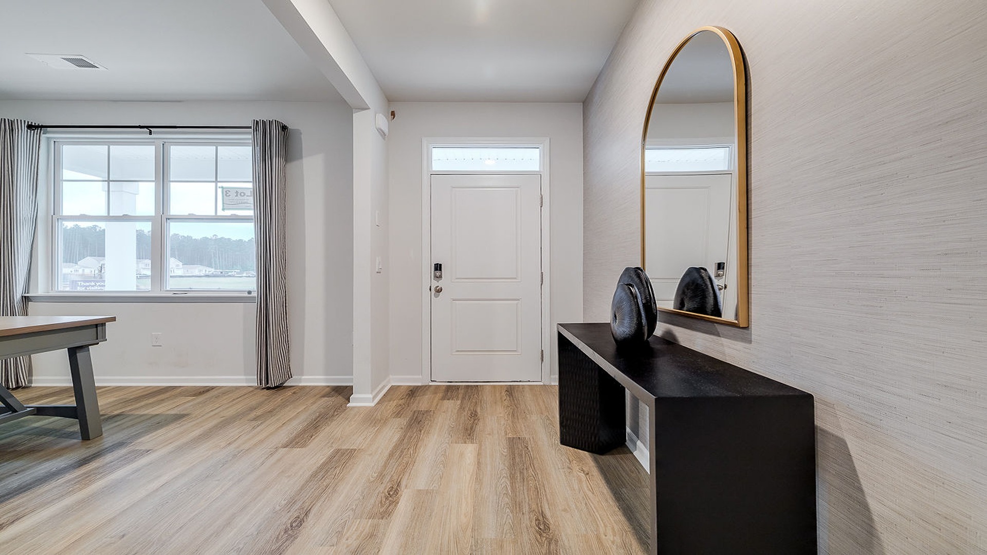 Foyer of home with view of the living room