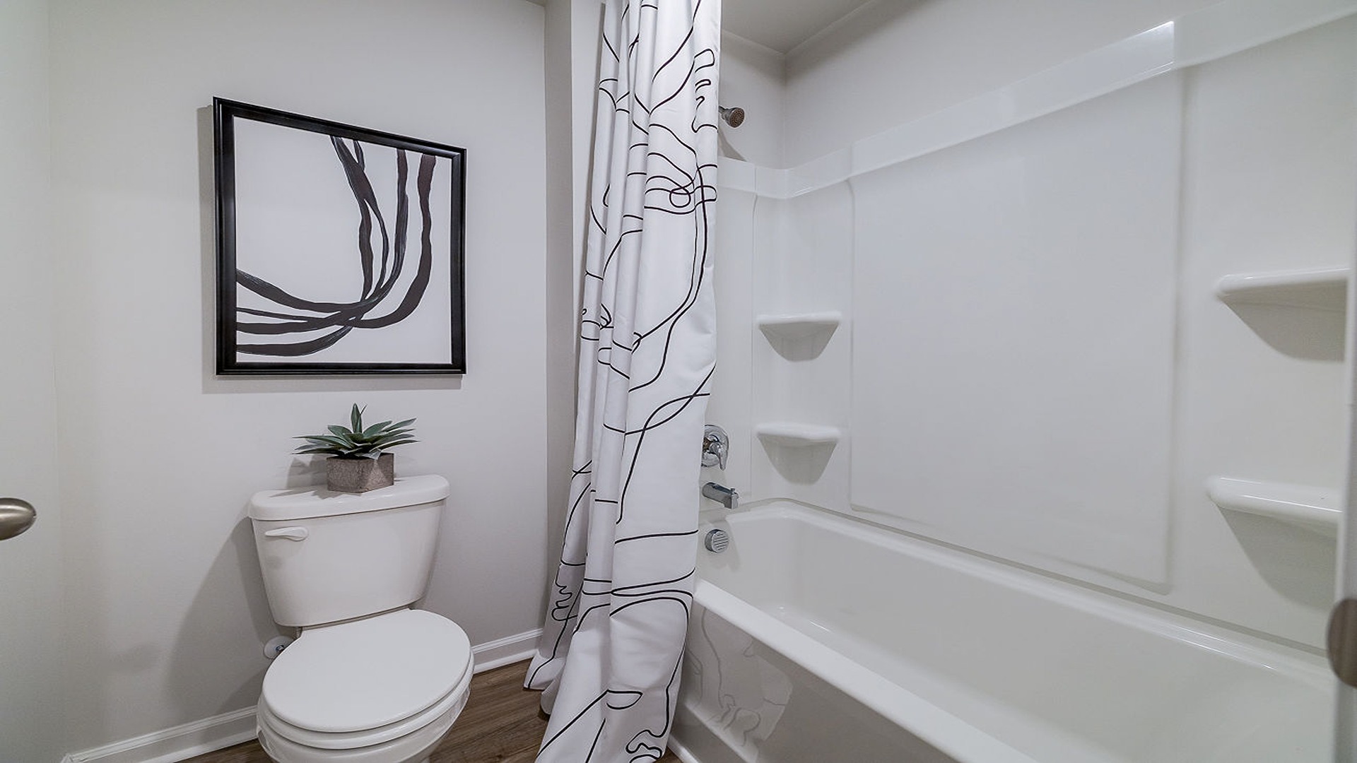 Guest bathroom with a tub shower
