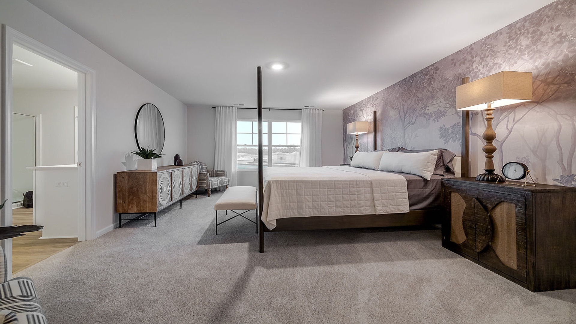 Primary Bedroom with a bed, dresser, and side table