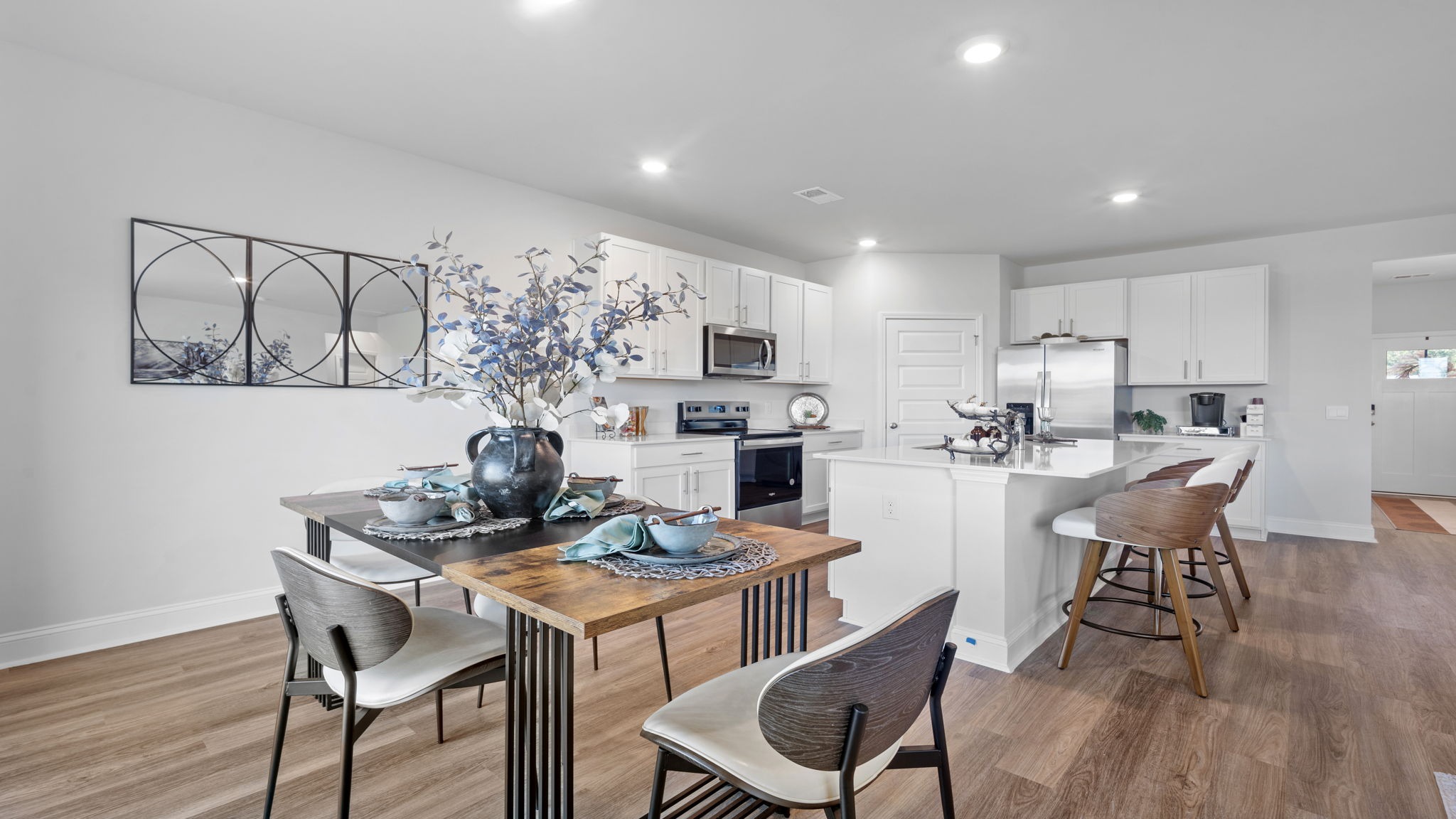 Elegant dining room in the Hayden floor plan featuring abundant natural light and seamless connectivity to the gourmet kitchen.