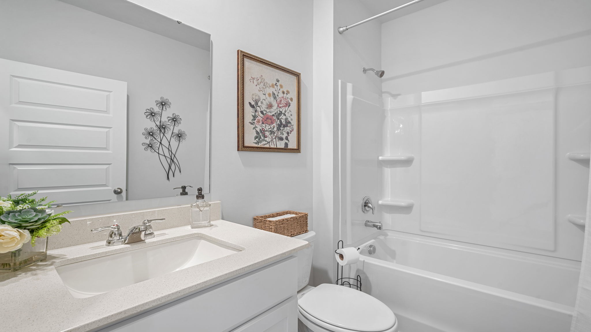 Stylish guest bathroom in the Hayden floor plan featuring modern fixtures, ample vanity space, and convenient access for family and overnight guests.