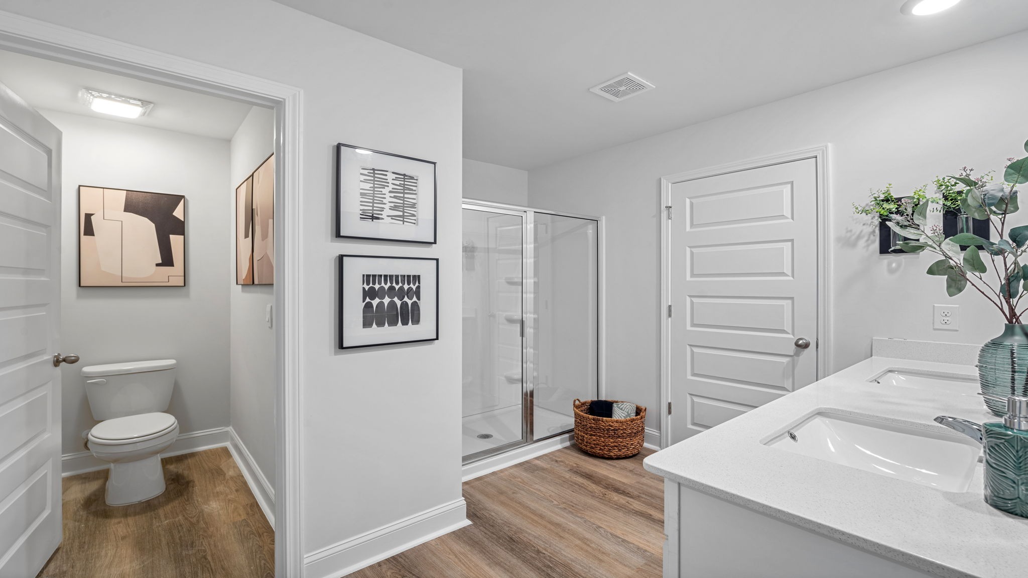 Spa-inspired primary bathroom in the Hayden floor plan featuring dual vanities, a walk-in shower, and elegant modern finishes.