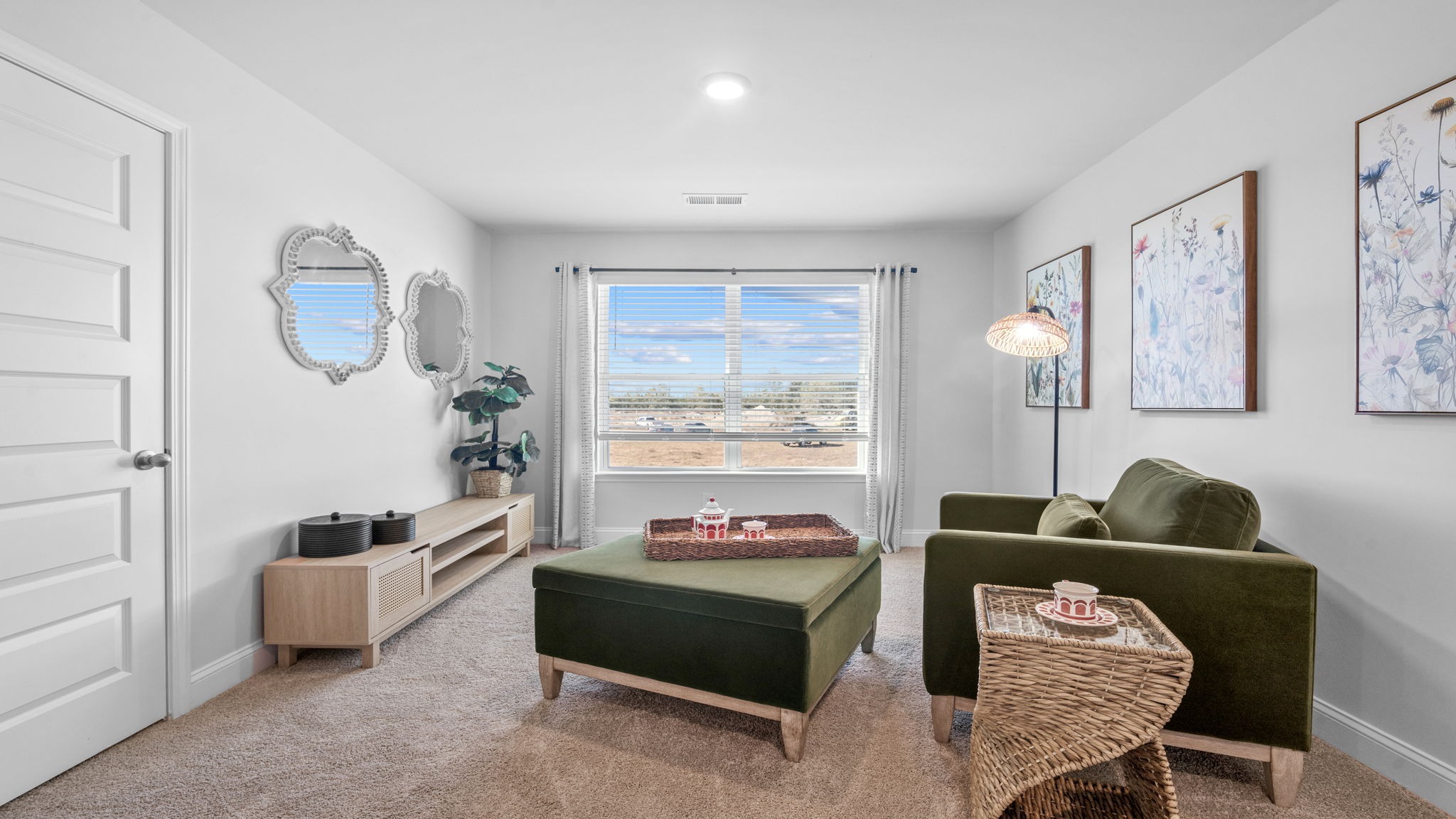 Expansive loft in the Hayden floor plan offering flexible living space perfect for a media room, playroom, home office, or second family room.