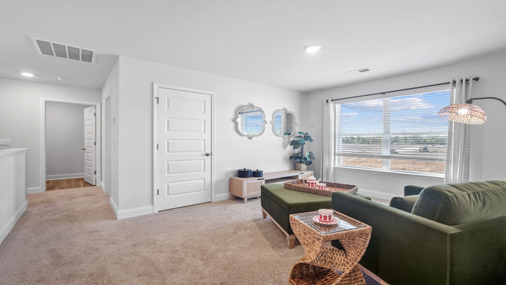 Versatile loft area in the Hayden floor plan creating additional gathering space for family activities, movie nights, and recreation.