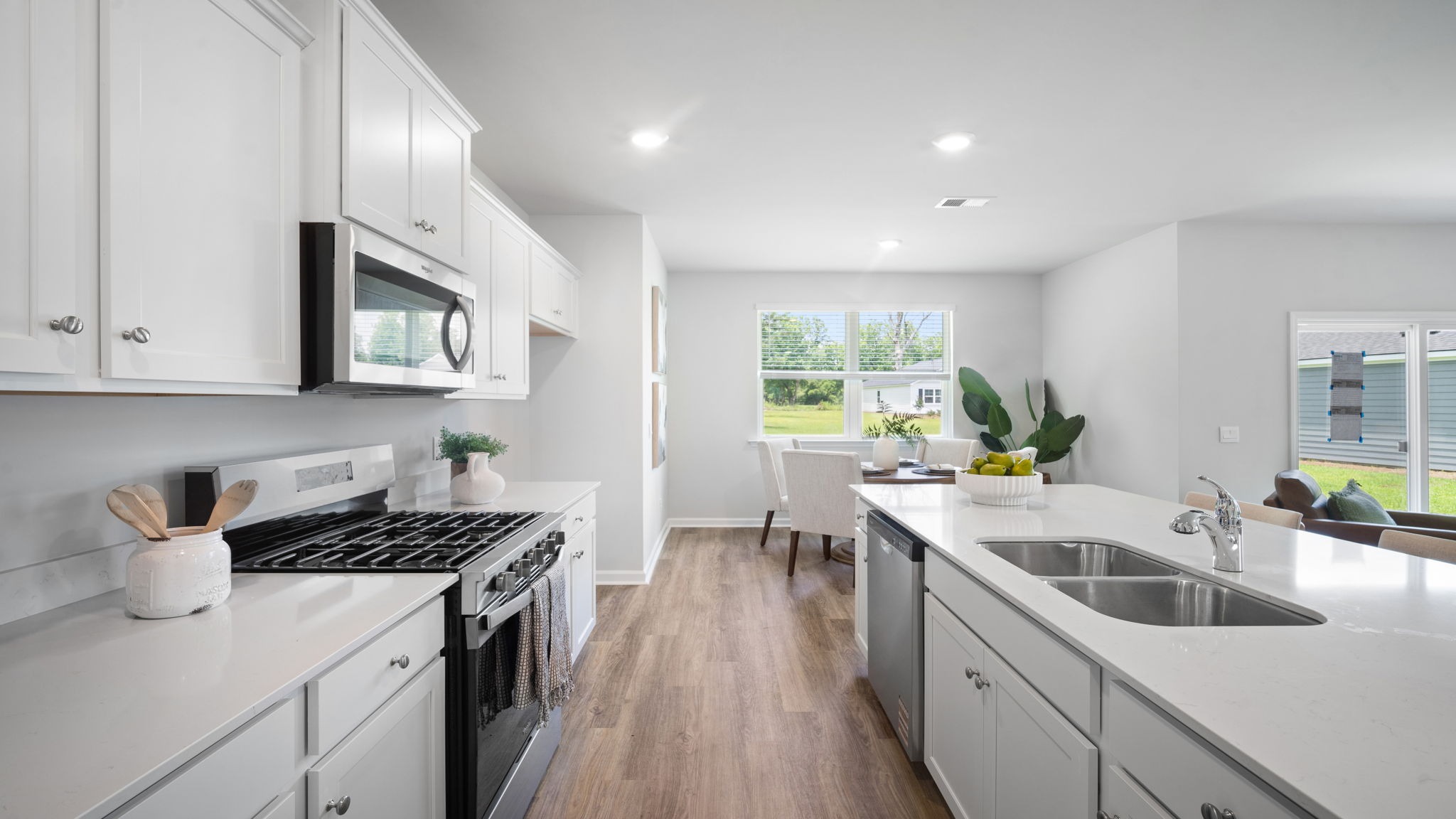 Kitchen walkway with counters on both sides