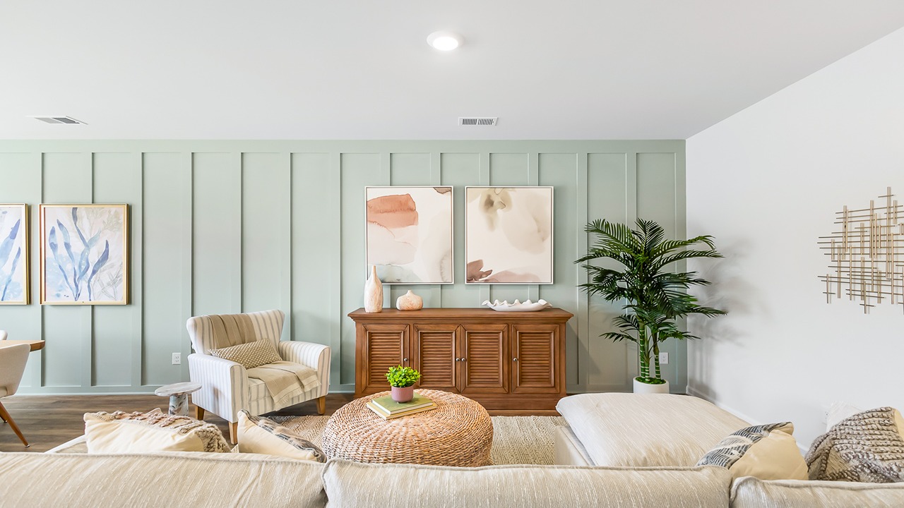 Open-concept living room in the Denmark floor plan at Old Bailey featuring abundant natural light, spacious gathering areas, and modern finishes.