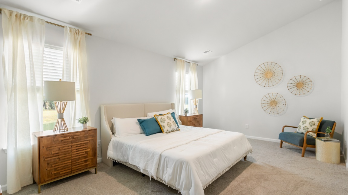 Spacious primary suite in the Davis floor plan featuring natural light, modern finishes, and a relaxing retreat atmosphere.