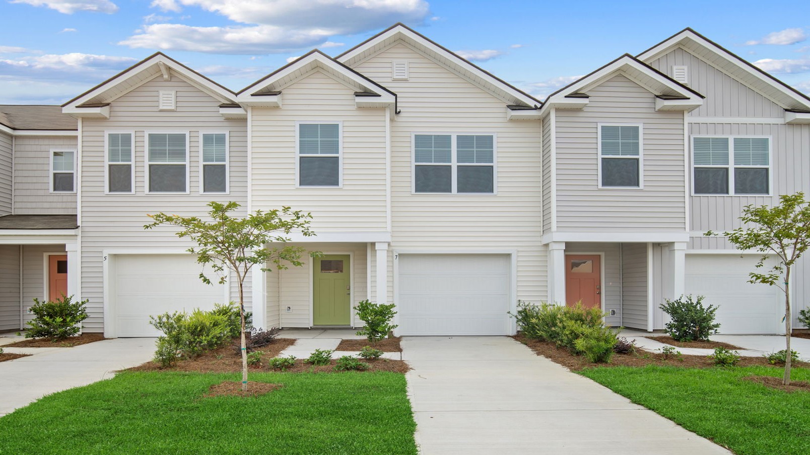 Davis floor plan in Old Bailey by D.R. Horton featuring modern Lowcountry architecture, attractive curb appeal, and professionally landscaped surroundings.