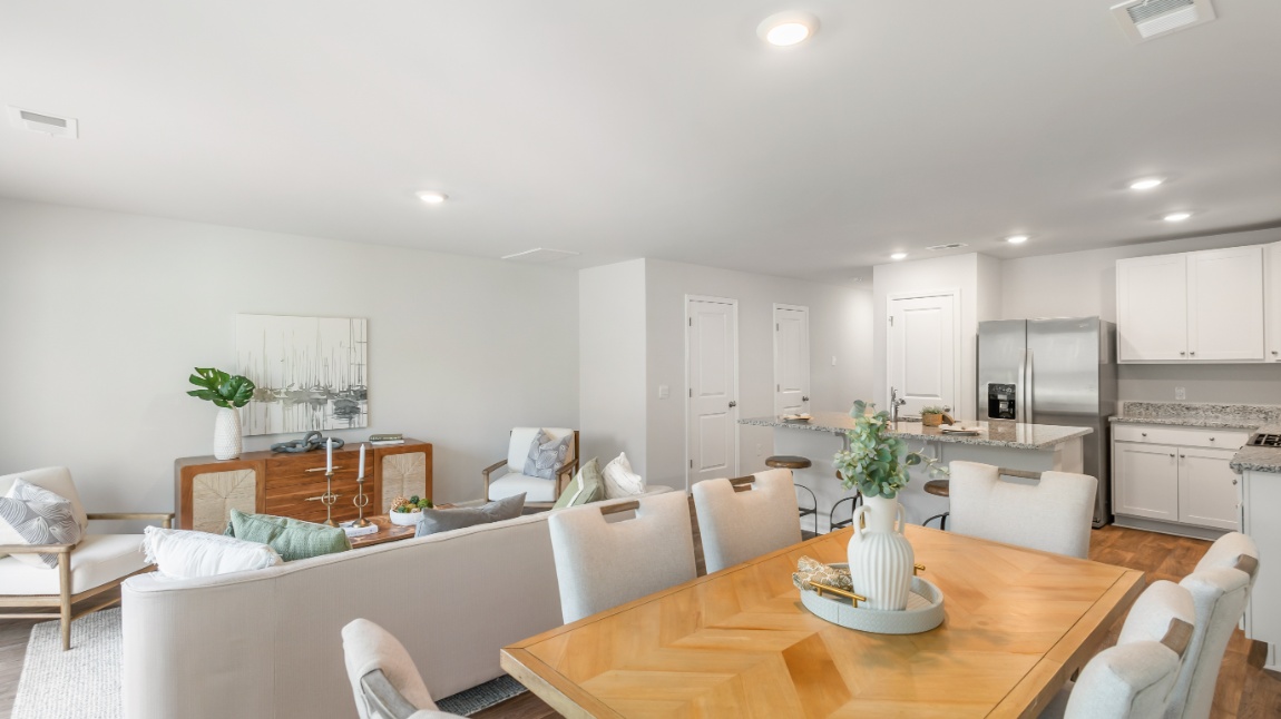 Spacious dining room in the Davis floor plan at Old Bailey featuring an open layout, abundant natural light, and easy access to the kitchen.