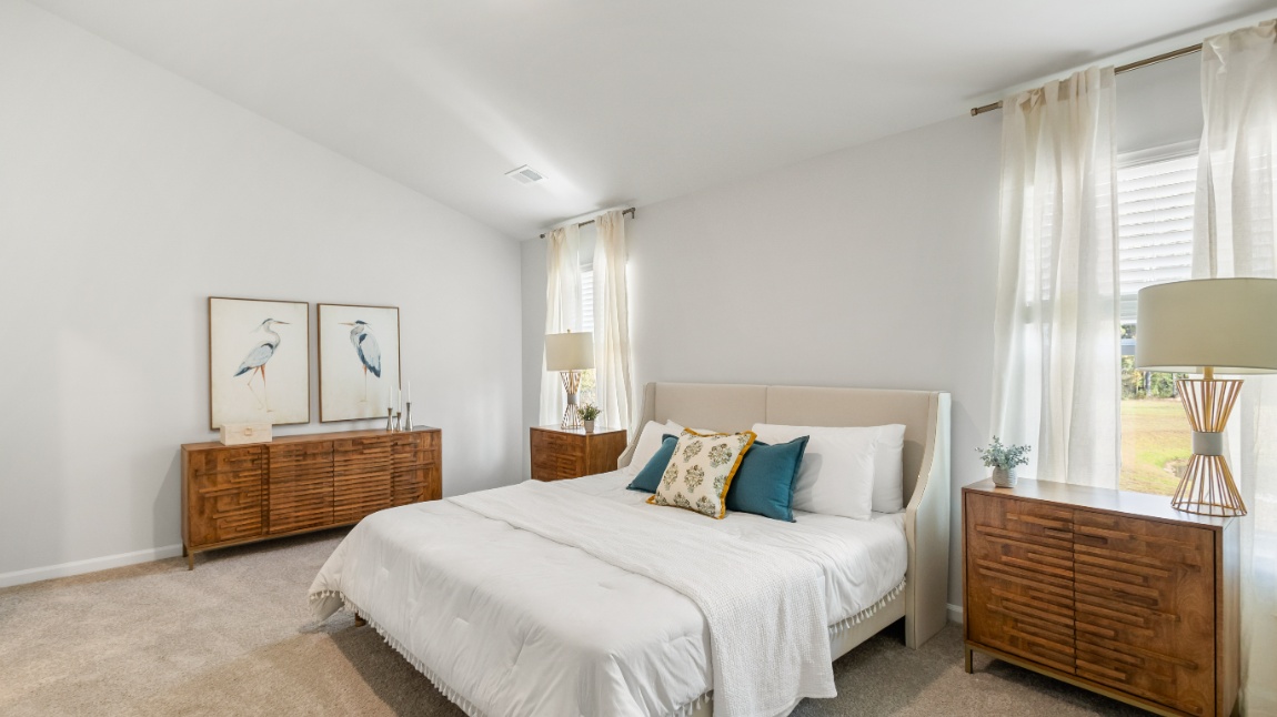 Owner's suite in the Davis home showcasing modern finishes, comfort, and thoughtful design.
