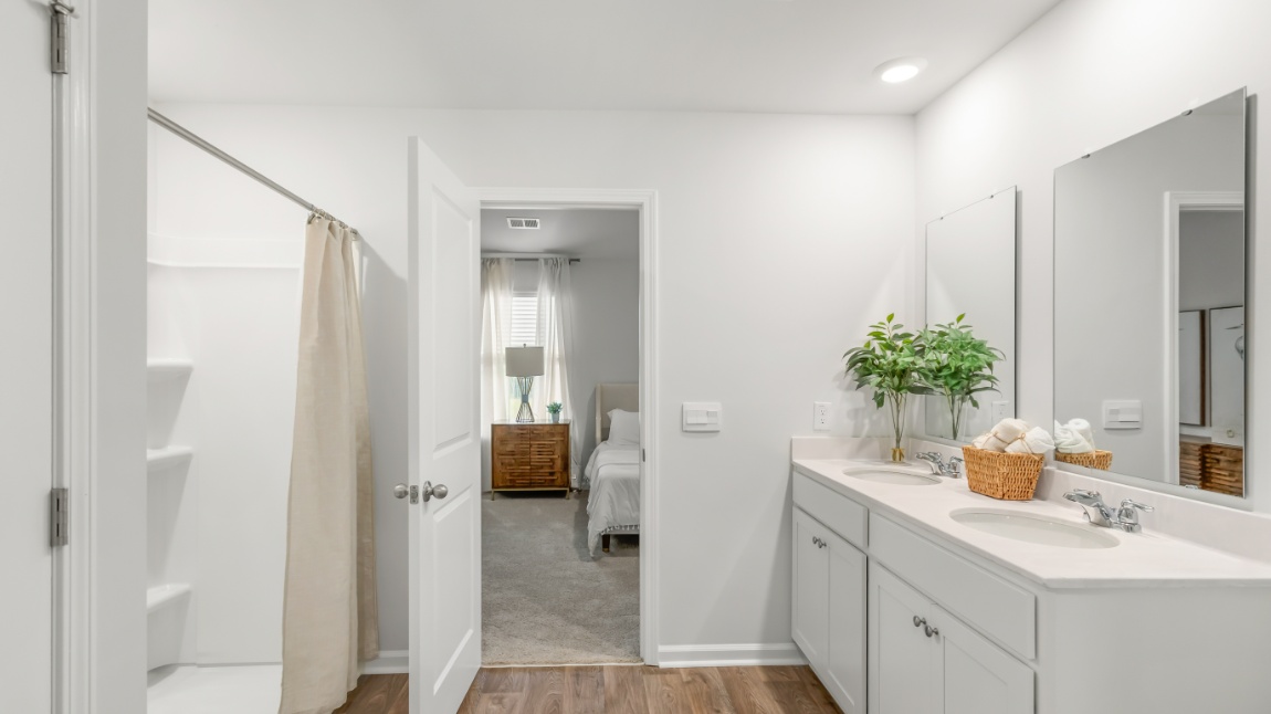 Spa-inspired owner's bath in the Davis home offering elegant fixtures, modern design, and everyday comfort.