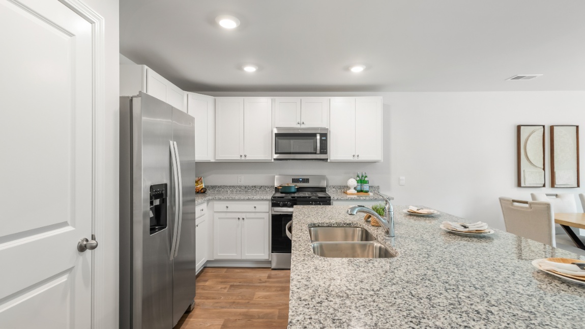 Modern kitchen in the Davis home at Old Bailey designed for entertaining with open-concept flow and contemporary finishes.