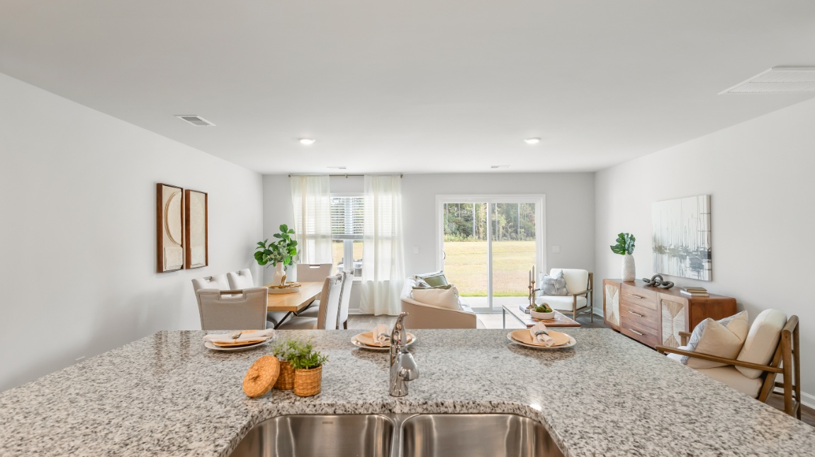 Beautiful kitchen in the Davis floor plan featuring a large island, stylish cabinetry, contemporary lighting, and functional space for entertaining.