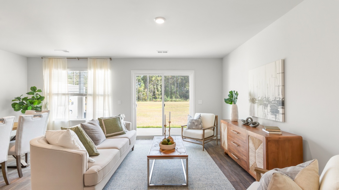 Open-concept living room in the Davis floor plan at Old Bailey featuring spacious gathering areas, abundant natural light, and modern design.