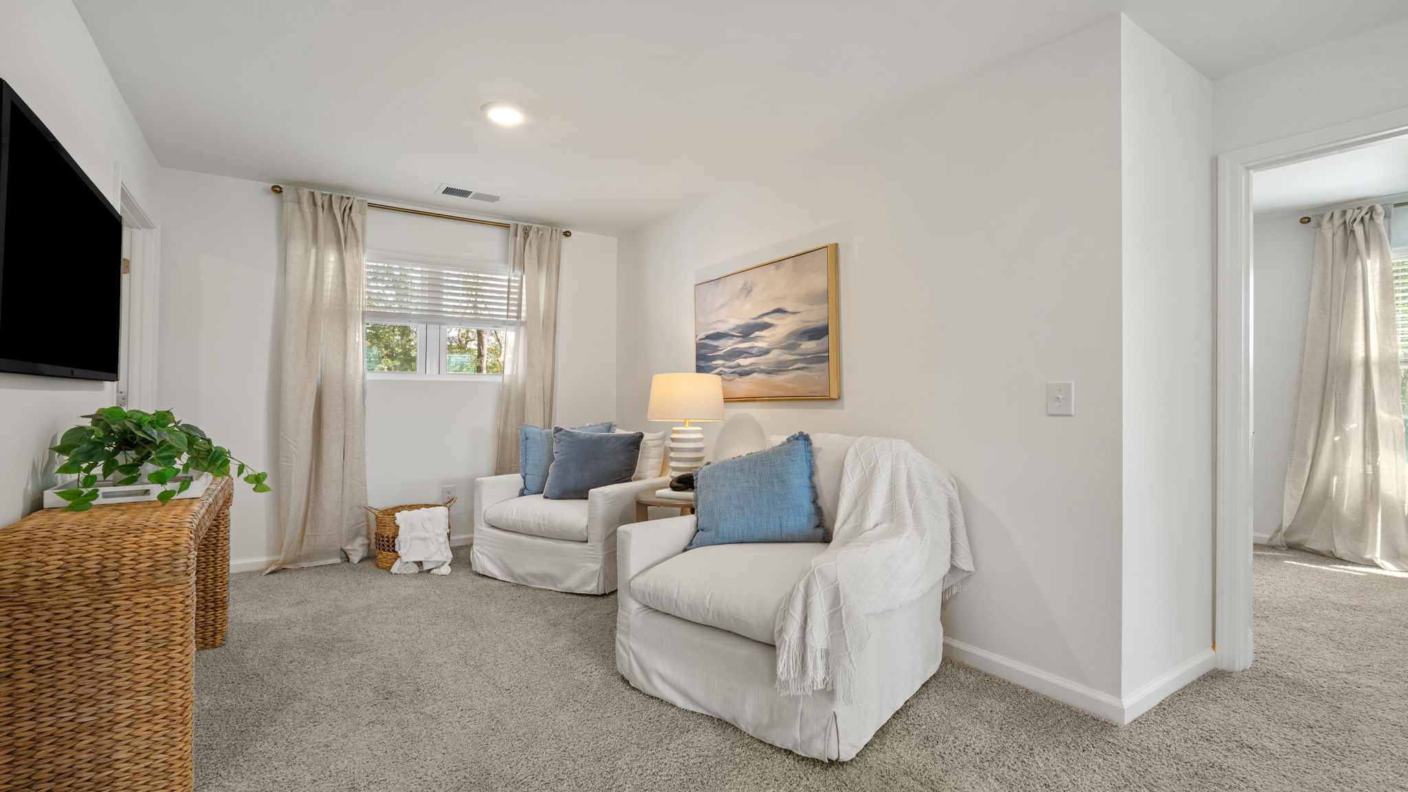 Open loft in the Norman townhome featuring flexible space for work, relaxation, or entertainment