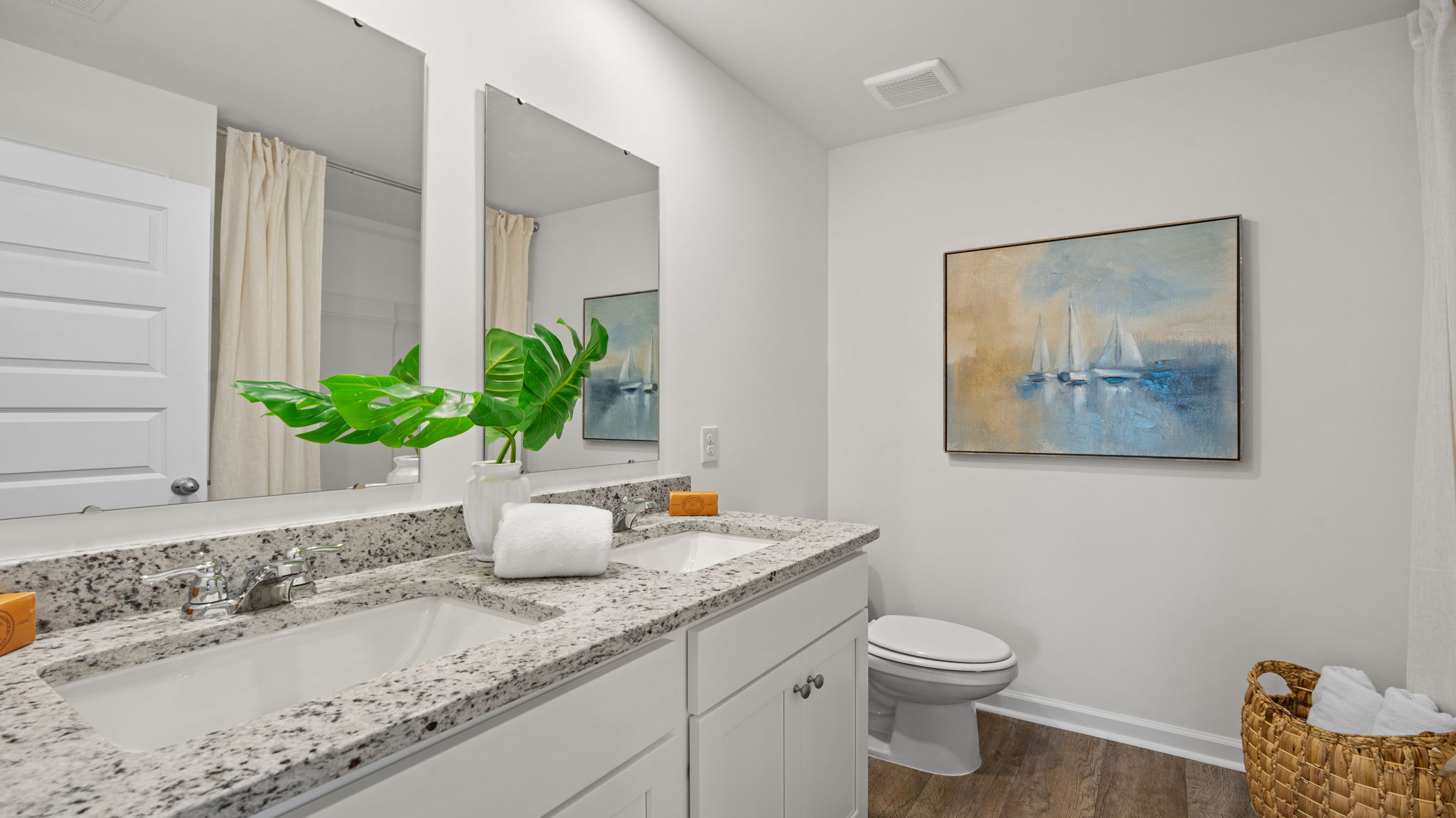 Full bathroom in the Norman townhome featuring modern vanity, durable finishes, and functional design