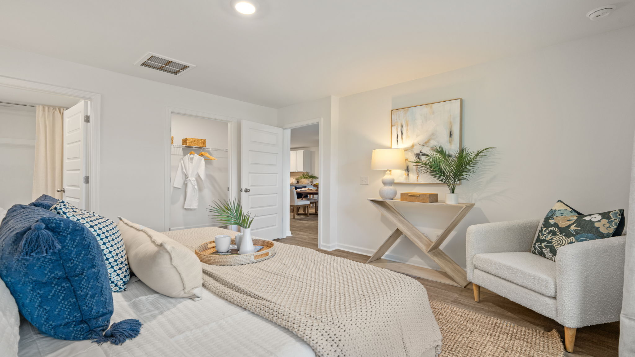 Owner's suite in the Norman townhome with private retreat, large windows, and comfortable living space