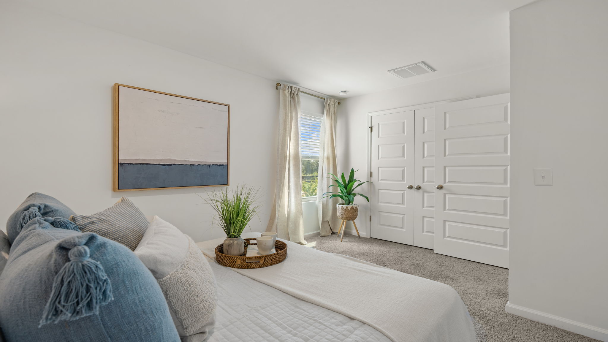 Additional bedroom in the Norman townhome featuring comfortable living space and modern finishes