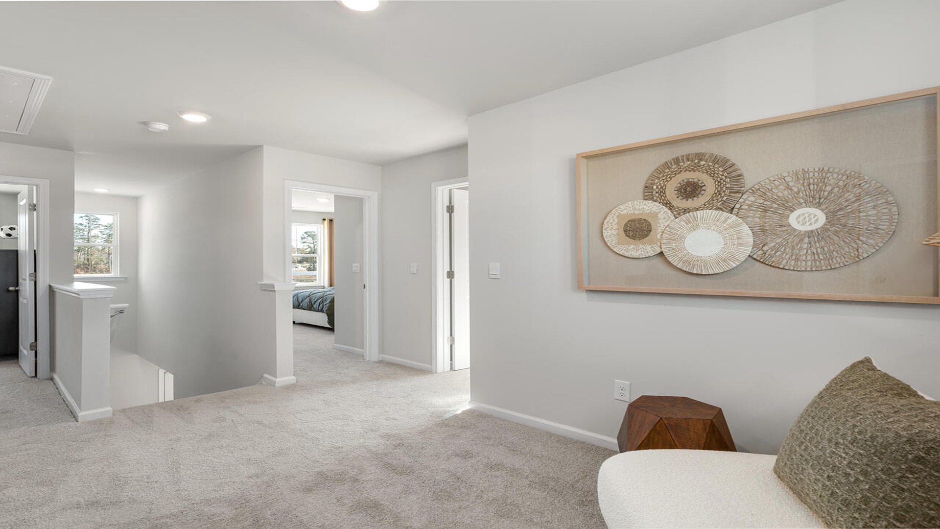 Second-floor loft in the Norman floor plan offering additional gathering space for work, relaxation, and entertainment.